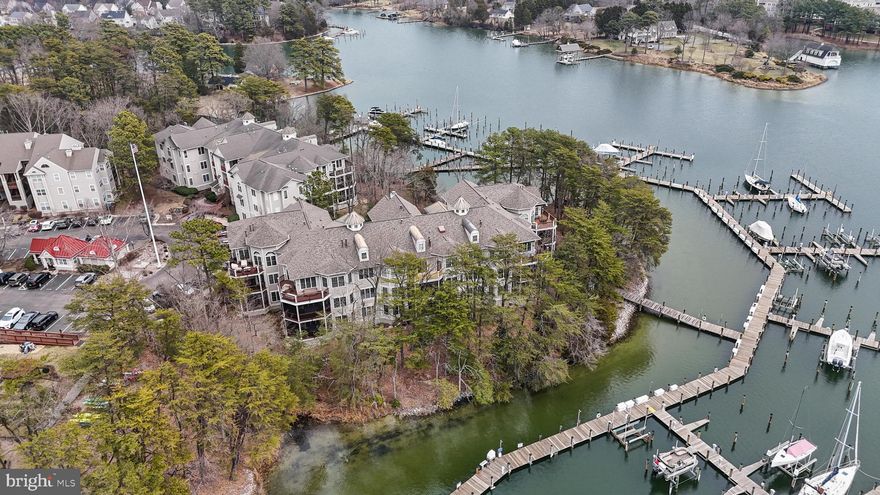 Welcome to your secure, private, waterfront oasis, just a stones throw from picturesque Solomons Island. Commute to PAX, or head into DC and Annapolis with straight-shot roads to make your journey enjoyable. 
This all encompassing three-bed, two full-bath unit on Runabout Loop offers every opportunity for worry-free living. Unit 603 has undergone major updating and maximizes on its floor-plan in the most flattering ways. Whole kitchen remodel features new quartz countertops, all new stainless appliances, an extra built-in freezer, a built-in beverage fridge, added storage, a deluxe pantry, extended bar, new cabinets, flooring, and lighting to name a few. Other updates throughout include new hardwood, new washer & dryer, new primary shower, new HVAC and gas furnace, added recessed lighting and a fresh paint makeover. Turn-key ready. 

The primary suite's water-views give abundant natural light and a private step-out to the screened-in porch (with stairs right to a walking-path arriving at docks and piers). Dual walk-in closets offer great storage solutions and enter into the updated primary bathroom with a large jet tub, new walk-in shower, open vanities and privacy. Bedroom 1, also has hardwood, and its own exit to the porch. Don't miss the hall full-bath and bedroom 2!
Aside from the incredible interior details of the unit itself, the community amenities really add to your lifestyle opportunities. Clubhouse outfitted with a fireplace, full kitchen, gathering area, party room, expansive deck, fitness center, tennis courts, tot-lot, car-washing area and serene picnic grounds give you endless opportunities to enjoy days ahead. Aside from the amenities on-site, let's not forget about the incredible creek. Wildlife and water enjoyment are all around you both inside the comfort of your home, and outside. Solomons Landing is a secure gated community, helping you relax and enjoy life's finest.