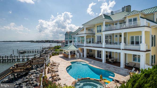 Welcome to the White Marlin Manor Estate. This property exceeds expectations!! This is one of the most stunning properties you will find on the East Coast. The location is unique with both Bay and Oceanfront access. This amazing custom build Southern Living Style Coastal home, features: 6 bedrooms, 7 Full Baths, 2 Half Baths, 2 Gas Fireplaces, 12 seat luxury theater, custom cabinetry, Wine Cellar, Granite Countertops, Tray Ceilings in every bedroom, Custom Tile Showers in each bathroom, Etched Glass Elevator with custom painted underwater scene, Designer Lighting, California Closets, Rod Iron Railings, Gourmet Kitchen with heated tile floor, 7 Sub Zeros, Commercial Ice Machine, Teak flooring throughout, 60,000 lb boat lift,7 Ft. MLW at Dock, so many ornate details reminiscent of the Eastern Shore of Maryland. All Buyers must be qualified with all documentation presented to listing agent prior to any showings.