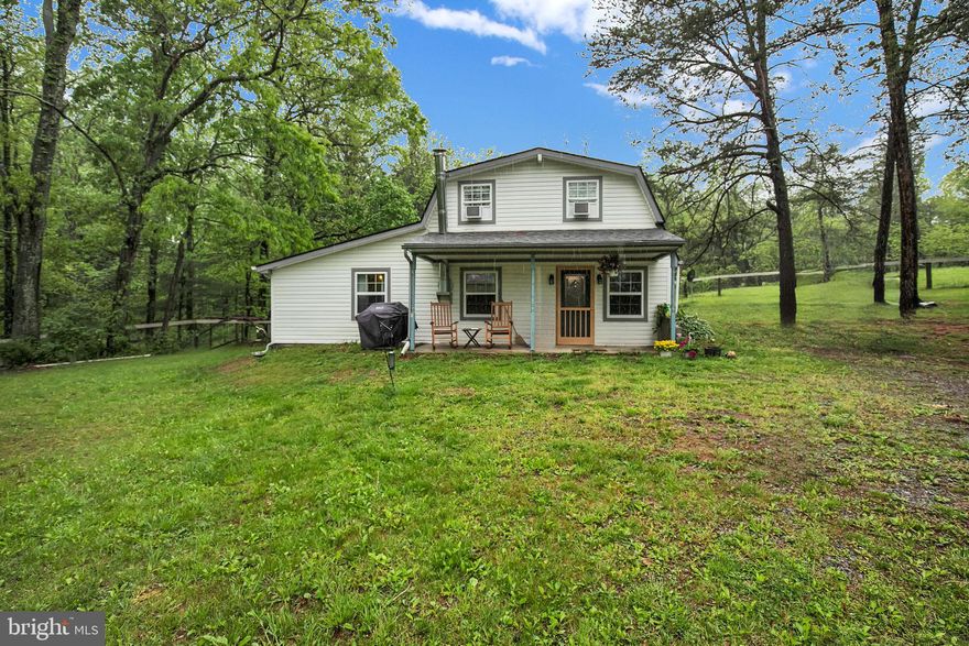 Incredibly quiet and private, this immaculately maintained home is nestled at the end of a long driveway, offering a peaceful retreat surrounded by plush greenery and a beautifully natural environment. With 3 bedrooms and 2 full bathrooms, the home features a convenient entry-level bedroom and main-level laundry, adding comfort and functionality to everyday living. The open kitchen is ideal for both casual meals and entertaining, while a wood-burning stove in the dining area brings a cozy, rustic charm. Recent upgrades include a brand-new roof, new carpet, and a new water heater, ensuring a fresh and move-in ready experience. Step outside to enjoy the expansive yard—perfect for gardening, relaxing, or recreation—and take advantage of two storage sheds for all your outdoor gear. Whether you're enjoying the peaceful setting or engaging in outdoor activities, this home offers a rare blend of privacy, natural beauty, and modern updates.