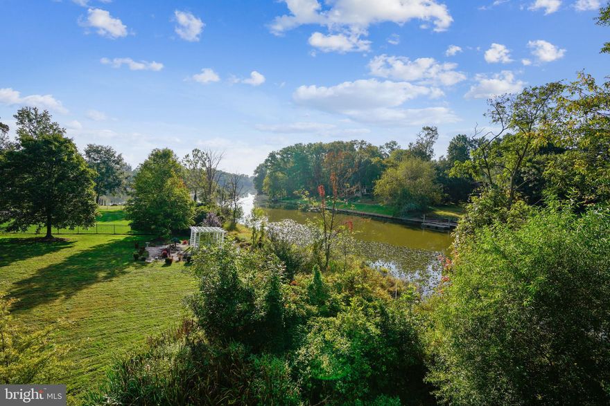 Retreat-like Woodland Park neighborhood is the stunning backdrop for this Creekfront home. Just 15 miles from DC along the picturesque GW Parkway and its’ bike and jogging trails, this home lives more like a retreat in the woods than a home close to an urban center. Have it all! Step inside and be wowed by the dramatic details: two story entry foyer, warm wood flooring on the main level, huge windows that flood the space with light, and a breathtaking sunroom with vistas of the Creek and lush backyard. The open floorplan has great zones for work, entertainment and family living. Renovated chef’s kitchen is the heart of the home with granite, stainless appliances and tons of warm wood cabinetry. Walk outside and decompress on the two level deck (lower level reinforced for hot tub), enjoy the lighted sport court or just put your canoe in and paddle away your worries. Upstairs, you will find 4 generous bedrooms, and 3 full bathrooms including a stunning owner’s suite with newly renovated bathroom with freestanding tub overlooking the Creek. Double sinks, huge shower, custom tile, separate closets and a large sitting space combine to make this the perfect retreat. Downstairs, you will find a large recreation room with walk-out doors, 5th bedroom, butlers pantry, and tons of storage for holiday decorations, family heirlooms and mementos. This space is already outfitted to take advantage of the outdoors with special storage for kayaks and convenient access to the rear yard. Easy access to major commuting routes including I-495, the GW Parkway and Old Town Alexandria. Huntington Metro and local bus routes are just minutes away as well. Welcome home!