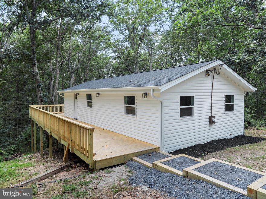 Welcome to this tucked away, newly renovated rancher on a finished basement in South Berkeley!  This 2 bed, 1 bath has lots of new offerings to include: windows, doors, vinyl siding, roof, HVAC, bathroom, LVP flooring, lights and paint throughout.  The kitchen offers brand new shaker cabinets with quartz countertops, and stainless steel appliances.  Opportunity for 2 beds upstairs, but currently set up as 1 bedroom upstairs and 1 bedroom downstairs.  There is tons of parking and a large, new deck to hangout on!  End of the culdesac too so no road traffic!