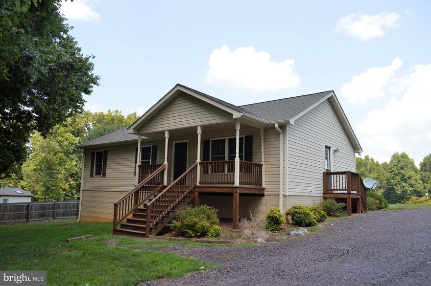 Rambler with 3 bedrooms, 2 full baths, and open floor plan in kitchen, dining, living area.  Hardwood floors on the main level (brand new hardwood floors in the bedrooms - July, 2017).  Upgraded appliances in the kitchen, Chair railings and ceiling fans are some of the other features. Full unfinished basement with full walkout on side gives room to expand later.  Front porch, side porch & deck.