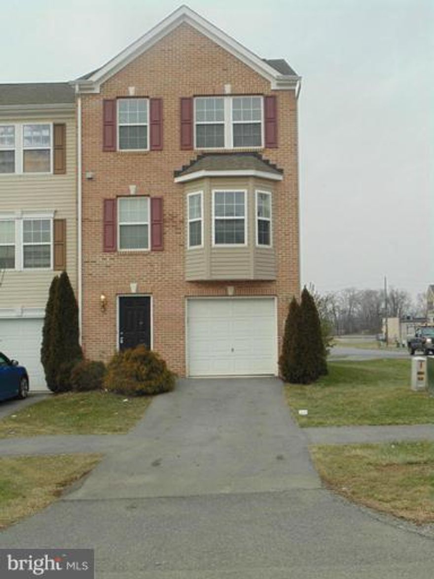 Remodeled three level brick end unit in popular Manor Park. New paint, hardwood floors, ceramic tile, appliances,blinds and more. Family room with ceramic tile, half bath and walk out patio. Main level with beautiful hardwood, new appliances, half bath,and deck. New carpet in all bedrooms and paint throughout three levels. Credit application required and pets allowed. Hurry will not lastlong!