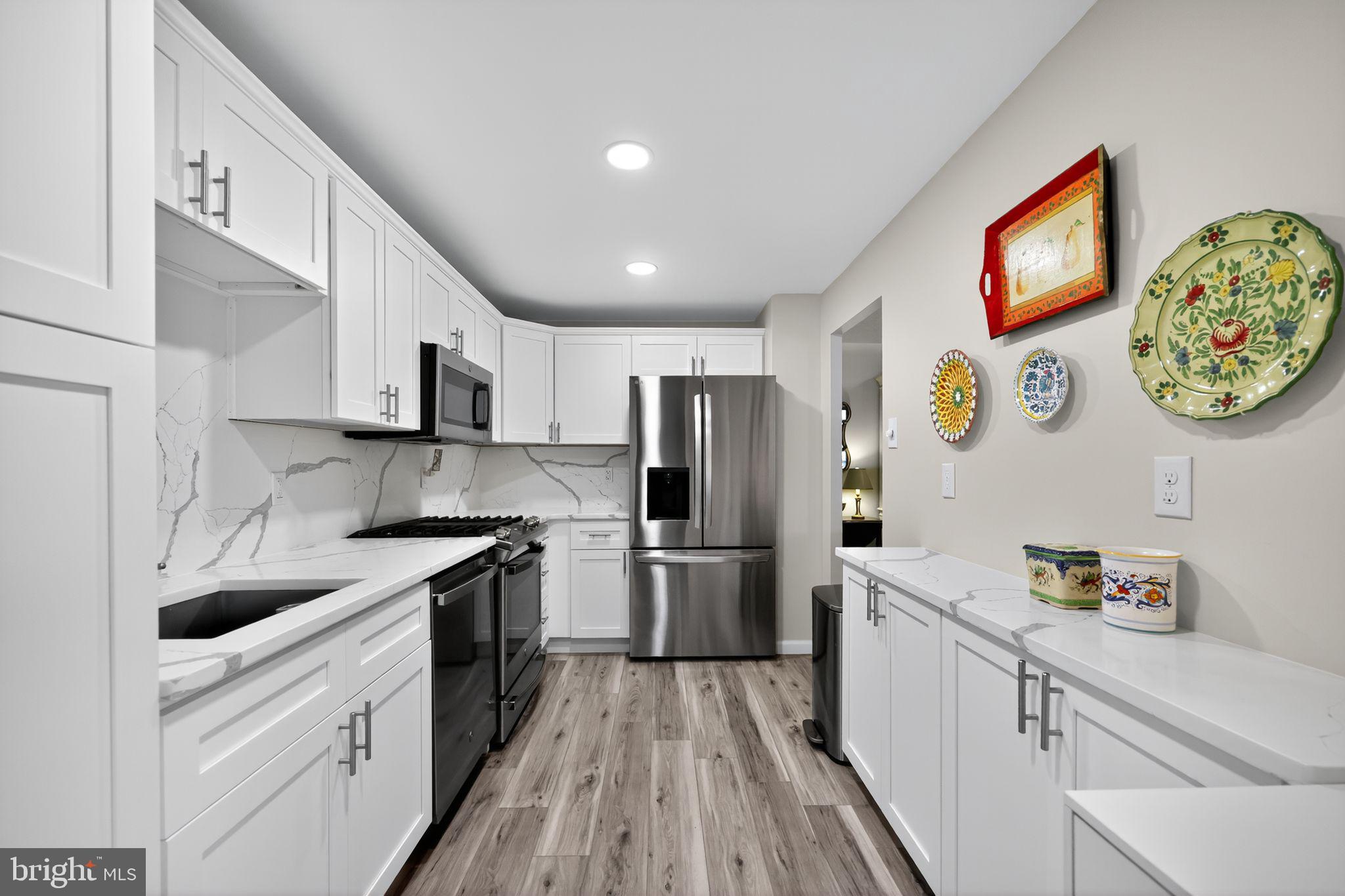 Welcome home to 801 Yale #818 – a beautiful, renovated 2-bedroom, 2-bathroom condo where you will enjoy exceptional maintenance-free living in the lovely town of Swarthmore. This corner apartment faces South and West with a large balcony facing Yale Avenue that provides a bonus outdoor space with privacy. Typical two bedroom apartments in the building are 1,050 square feet, but this end unit is 1,210 square feet. Seller has invested approximately $30,000 in updates including a full kitchen renovation, laundry with new washer/dryer, custom neutral painting throughout, and improved bathroom lighting. Enter the gracious unit and discover an open floor plan that is full of natural sunlight. To the right is a stunning new kitchen that boasts gorgeous white cabinetry, quartz counters and backsplash, and stainless appliances that include a gas range. The kitchen flows to the formal Dining Room and elegant Living room with sweeping views of Swarthmore – a perfect place for entertaining or everyday living. The hallway has been thoughtfully designed to include a large laundry room with new stackable W/D and plenty of room for storage. Continue to the sizable guest bedroom that can also be used as a home office. Across the hall is a full bathroom with tub shower combination. The grand primary bedroom suite faces south and has a beautiful view of the stately copper beech tree and the community gardens beyond. It offers an abundance of closet space and an ensuite bathroom with a stall shower. This exceptional unit also includes a deeded carport #8 for convenient covered parking located in the parking lot on the Yale Avenue side of the building. . The Strath Haven Condominium is well located near to the sprawling college campus, beautiful trails, the regional train station and downtown Swarthmore with its charming shops and restaurants. The monthly condominium fees include gas, electric, water, sewer, trash, maintenance of exterior and common areas, snow removal, pool use, library, hobby room, and free shuttle van to shopping areas. The only additional expense is cable/internet.