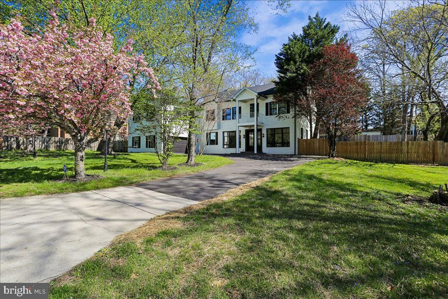 Modern Luxury Living in the Heart of Potomac Village
Completely rebuilt from top to bottom in 2024, this extraordinary 6-bedroom, 5.5-bath contemporary home ideally situated in the heart of Potomac Village and zoned for Winston Churchill High School, sits on a beautifully landscaped .43-acre lot with a circular driveway and standout curb appeal.
From the moment you step inside, the home feels open, airy, and effortlessly welcoming. Sunlight pours through oversized Pella windows, illuminating wide-plank engineered oak floors and refined details like crown molding, modern wainscoting, and soft recessed lighting. The main level is designed for both easy daily living and seamless entertaining, anchored by a stunning chef’s kitchen. Here, an oversized quartz island invites gathering, while custom soft-close cabinetry, a ceramic farmhouse sink, and a professional-grade Bertazzoni six-burner range make cooking a true pleasure. Tucked just behind, a fully equipped catering kitchen ensures you can host everything from intimate dinners to large celebrations with ease. A first floor laundry, mud room, and full bathroom with walk-in shower are adjoining as well as access to the oversize two-car garage.
The living space flows naturally, with soaring 10 foot ceilings centered around a cozy wood-burning fireplace—perfect for quiet evenings or lively get-togethers. A main-level bedroom with a walk in closet and extra powder room complete this floor.
Upstairs with 9 foot ceilings, the primary suite feels like a true retreat. Wake up to soft natural light, then unwind in a spa-inspired bath finished in marble, complete with a soaking tub, dual vanities, and a glass-enclosed rainfall shower. A dedicated dressing area with his and hers  walk-in closets and its own laundry adds a layer of everyday luxury. A striking circular staircase leads to a massive loft space with LVP flooring suitable for home gym, creative studio, or quiet workspace.
Each of the four additional bedrooms is generously sized and thoughtfully designed. Bedroom 2 with ensuite bathroom with rainfall shower and designer tile details. Bedroom 3, 4 and 5 share a full hallway bathroom with walk in shower and honeycomb tile floor detail.
Step outside and the home transforms into your own private resort. Spend summer days by the beautifully updated swimming pool, host dinners on the expansive patio, or simply enjoy the peaceful setting of lush lawns and garden beds under the stars.
The finished lower level extends the living space even further, with a full wet bar, recreation area, bonus room, and tucked-away nooks that make it ideal for entertaining, relaxing, or hosting overnight guests. Additional upgrades in this home include an electrical system heavy up to 400 amps and all new plumbing/pipes.
All of this is just moments from the shops and restaurants of Potomac Village, scenic parks, River Road, and the renowned Congressional Country Club—bringing together convenience, community, and luxury in one exceptional home.