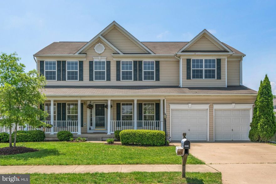 Freshly painted and new carpet!  This colonial offers over 3000 sq ft of living space, tall ceilings, tons of light, open floor plan, wood floors on main level!  Family room with gas fireplace, kitchen with granite countertops, soaking tub in master, laundry on upper level, rec room in basement with tons of storage!  Large wrap around porch for relaxing and fenced backyard with patio for grilling!