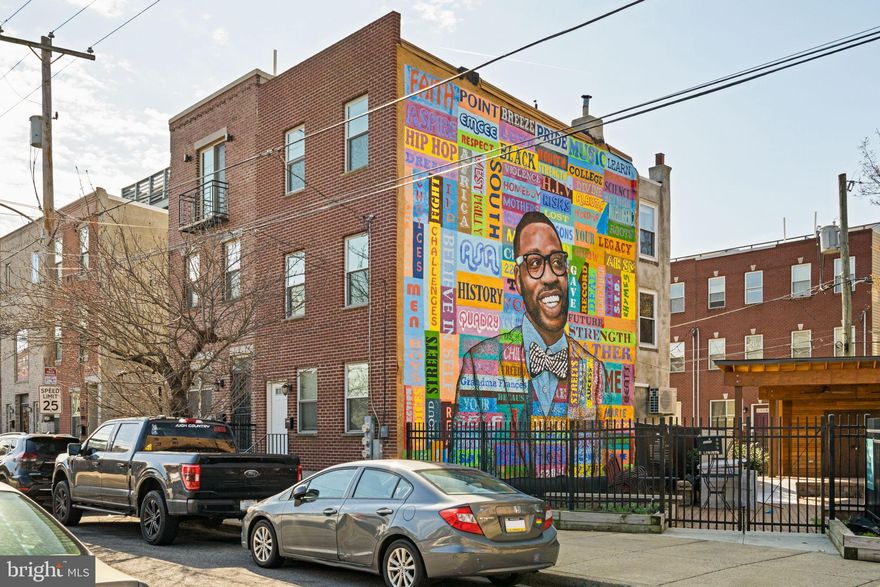 Legal DUPLEX with 2 CAR PARKING in Point Breeze! This spacious and recently renovated home is located on an end lot next to the community maintained and beloved “Concert Garden” which showcases one of Philadelphia’s Mural Arts masterpieces. The bi-level upper unit is filled with natural light and hardwood flooring throughout making it perfect for an owner occupant or premium rental. Enter the private stairway to the 2nd floor owner’s unit where a large dining area flows into the bright and welcoming living room. Through the open living space you will find a recently updated kitchen featuring stainless steel appliances, a classic subway tile backsplash, ample cabinet and storage space as well as a breakfast nook for an additional dining space. Moving upstairs there is a spacious den space with custom built-ins creating the perfect home office. The generously sized bedroom has open shelving, a double closet and large windows that pour in sunlight and perfectly frame the Center City Skyline. A full bath with walk-in shower, oversized vanity and washer/dryer is also located on this floor. The first floor unit offers a great rental opportunity and similar to the upstairs showcases a bright and open living space. Enter into the spacious living area with an open concept kitchen including a large counter with seating, updated appliances along with convenient storage and cabinet space. A full bath, good sized rear bedroom and private basement laundry finish out this ideal bonus rental. Two parking spaces are at the rear of the building on this street to street lot. Location is everything at 2054 Ellsworth St! The community garden next door provides plenty of added outdoor space and it's just blocks to neighborhood staples like Dock Street Brewery South, Porco's Porchetta, Breezy's Deli, Aldi, CVS, and so much more!