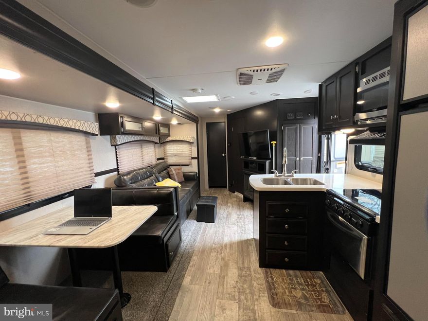 Great opportunity to own a waterfront lot and gorgeous camper in Indian Acres! The camper is a 2019 Sporttrek touring edition 343VBH bunkhouse with 2 bedrooms and 1.5 bath's! This campground offers endless fun with year round events and tons of outdoor activities! Just in time for summer, you and your family can go fishing, biking, swimming in one of the three pools, boating, play mini golf or regular golf on their 9 hole course, canoeing, five lakes, playground, onsite laundry facility, restaurant, volleyball, pickleball and so much more! Concerts and events held by the big teepee! This is the place to retreat, have fun and make great memories all while still being close to shopping, restaurants, gas stations, hospital and the interstate. Come take a look!