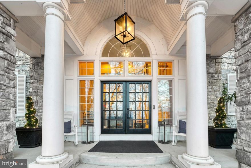 Offering over 5,400 square feet of luxurious living space, this home makes a stunning first impression with graciously curved entry steps, elegant pillars, and a deep front porch with front row seats to gorgeous sunsets and sensational panoramic views. Exquisite, tall glass transom and wide sidelights surround 8’ double doors and welcome you into the magnificent two story foyer. Fully equipped chef’s kitchen, 66" Thermador refrigerator, Viking gas range with griddle, double Viking ovens, professional exhaust fan, vegetable sink, reverse osmosis, spice door pullouts and Miele dishwasher with cabinet door to blend with the kitchen seamlessly. Breakfast bay with full glass doors overlooks the private wooded homesite. Designed for flexibility and comfort, the home offers dual owner suites, one on the main level and one upstairs. The palatial upper level retreat features a 4' tray ceiling with skylights, a cozy gas fireplace, sitting room and access to a romantic private balcony. The first floor bedroom could double as a primary suite or a guest suite featuring 10’ ceilings, a jetted tub, separate tile shower, and a furniture grade vanity. Three additional upper level bedrooms each include their own full bath. The main level is completed by a generous dining room, living room, vaulted den with bay windows and 11' family room with gas fireplace flanked by dual 8’ glass doors. This home offers privacy without sacrificing accessibility.  Imagine a charming European village where enduring masonry wraps every home and striking rooftops create a storybook setting. Highly sought after Derry School District, luxurious appointments, striking stone facade, and a gorgeous two acre wooded homesite in The Oaks of Hershey. Conveniently located just minutes to downtown Hershey and Hummelstown, Rt 322, and less than two miles from Penn State Hershey Medical Center, nearby to Bullfrog Valley Park, Shank Park, and the 17-mile Jonathan Eshenour Memorial Trail. Call today to schedule your own private tour.