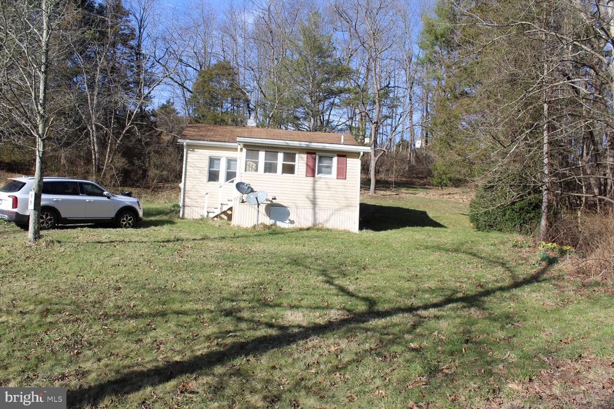 Located just outside of town, close to the Upper South Branch of the Potomac, this 2 bed, 1 bath home is perfect for your weekend getaway or first starter home.  Home is sold "AS-IS", but with a little imagination could be a beautiful place to call home.