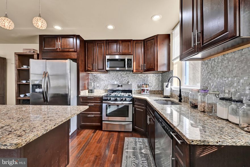 Buyer got cold feet! We are thru inspections AND appraisal! Take a look at this amazing property! Beautifully reimagined and thoughtfully priced, this residence showcases two opulent primary suites, each appointed with sumptuous en-suite baths. The chef’s kitchen dazzles with high-end stainless steel appliances, sleek granite surfaces, and impeccable finishes. An upper-level laundry, a stylish main-level powder room, and refined tray ceilings enhance both comfort and sophistication. Gleaming hardwood floors throughout complete the home’s graceful ambiance. An exceptional offering—not to be overlooked!