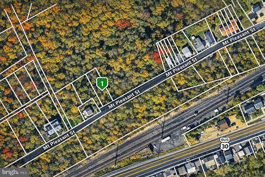 Affordable building lot located on a quiet cul‑de‑sac near the Valley Township border, outside downtown Coatesville City. This well‑positioned property offers flexible RN‑5 zoning, allowing for a variety of residential development options including single‑family detached homes, semi‑detached twins, townhomes, and multiplex units, subject to required municipal approvals.
Public water and sewer are available in the street, helping to streamline future development. Some engineering work has already been completed, providing a head start for builders or investors—remaining approvals are required prior to construction. The lot has been pinned and is surrounded by newer townhome development nearby, underscoring the area’s continued growth and demand.
Owner will consider selling this lot individually or in combination with other nearby lots listed separately, offering scale and flexibility for larger development concepts. A rare opportunity for builders, developers, or end‑users seeking a quiet setting with strong residential potential and multiple permitted use paths.
Buyer and buyer’s agent are responsible for verifying zoning, permitted uses, density, utilities, boundaries, and all development requirements with the appropriate municipality. Property is being sold as‑is.