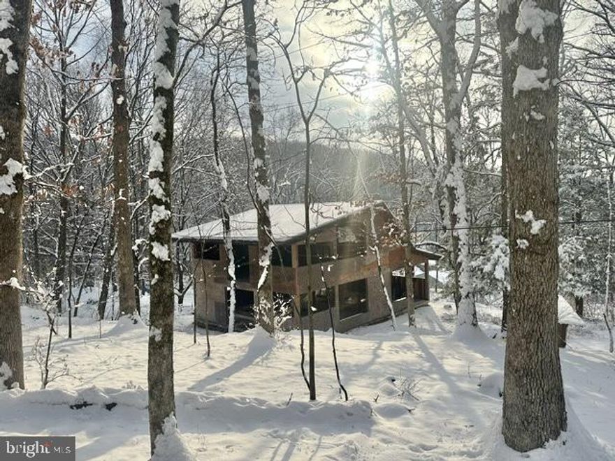 Beautiful wooded 1.27 Acre lot in the Kutztown school district. Tucked away on a slight hill this property feels private.  This home is ready for your completion to create a space completely to your tastes. Along with the newer metal roof, 200amp electric service, pegged oak posts, there are remnants of past dwellings where a bank barn used to be as well as a 70' long stone retaining wall.  A local builder had started the process of rebuilding off an existing property using locally sourced materials. There are too many intricacies to this rebuild to mention but the Seller has supplied a detailed description upon requests.