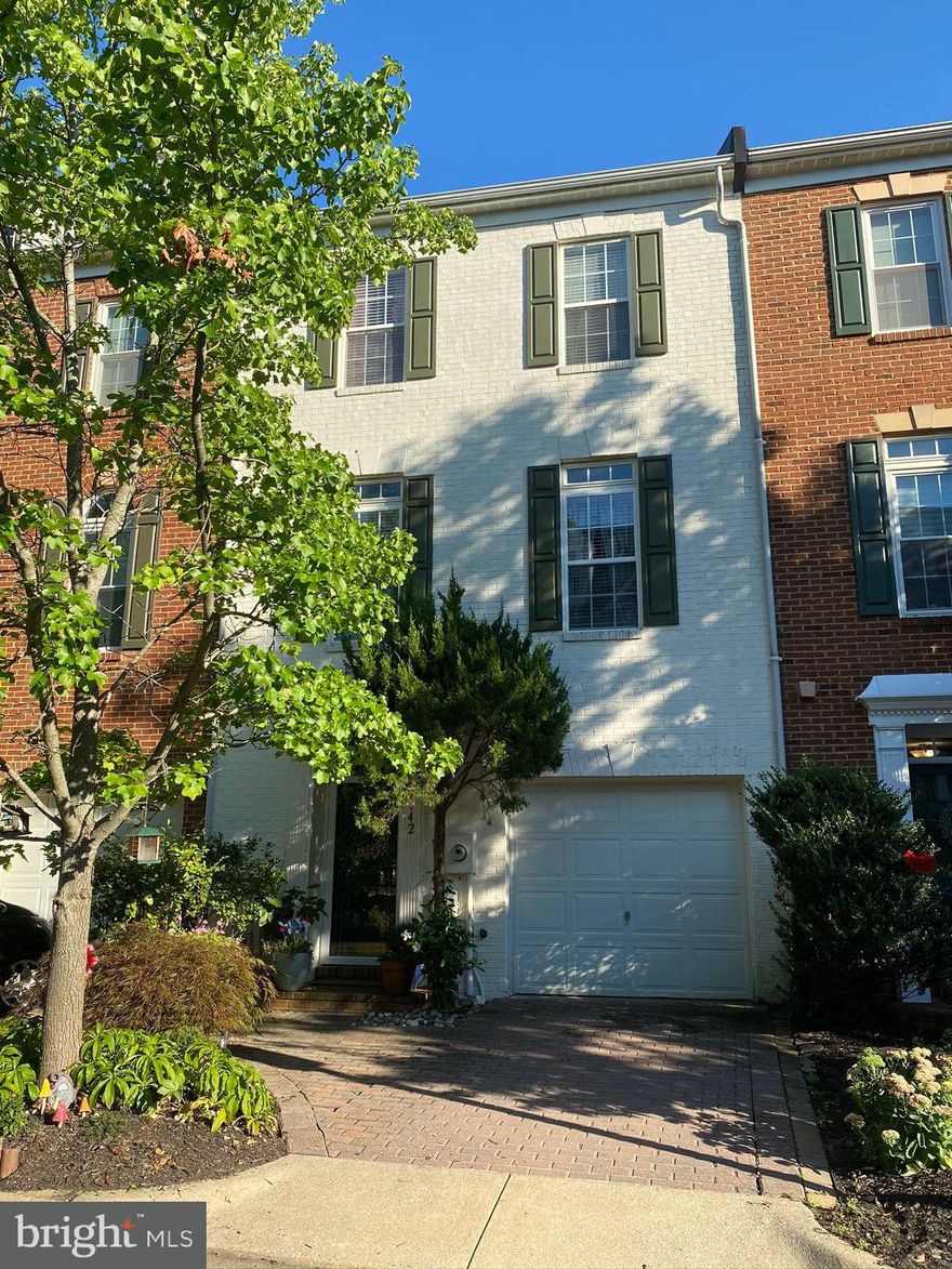 Assumable VA loan at 3.625% for qualified buyers. Exceptional opportunity to own a beautifully maintained Franklin model townhome in the highly desirable Cameron Station community. This elegant three-level residence offers approximately 2,116 square feet of thoughtfully designed living space, featuring 3 bedrooms and 2.5 baths with abundant natural light throughout. Fresh neutral paint, classic white crown molding, and an open, inviting layout create a timeless and sophisticated feel. The updated kitchen showcases granite countertops, stainless steel appliances, a gas range, and refreshed cabinetry, opening seamlessly to the breakfast area and a charming shaded balcony, perfect for morning coffee or relaxing outdoors. The adjoining sunroom with fireplace and spacious living room provide ideal spaces for entertaining or unwinding. On the upper level, the primary suite features a cathedral ceiling, an expansive walk-in closet, and a generously sized ensuite bath. Two additional well-proportioned bedrooms and a full bath offer flexible living options. A full-size washer and dryer and pre-installed security system add everyday convenience. The entry level includes a comfortable family room and access to the attached one-car garage, with additional parking conveniently located directly in front of the home. Residents of Cameron Station enjoy access to extensive community amenities, including a fitness center, pool, basketball courts, parks, walking and biking trails, and dog parks. The neighborhood also offers a complimentary shuttle to the Van Dorn Metro, along with nearby shops, dining, daycare center and everyday conveniences along Cameron Station’s Main Street. Ideally located just minutes from Old Town Alexandria, with convenient access to the Mark Center, Fort Belvoir, and Washington, D.C., this home offers the perfect blend of comfort, style, and connectivity with a Pentagon direct bus from Cameron Station.
