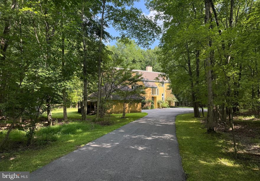 It all starts with 6.4 acres of land on S Devon Ave in the heart of Devon PA. The lot contains a 6 bedroom 5 and 1/2 bath custom-built home by Philadelphia Architect William Washburn . The home features 10 ft ceilings on the first floor with woodland views and a set back with woodland privacy from the street.  
In addition, there are 3,  township approved, building lots on Longchamps Dr, each just over an acre with EDUs as well as access to public sewer, water and Natural gas.  Please see Plot plan photo.