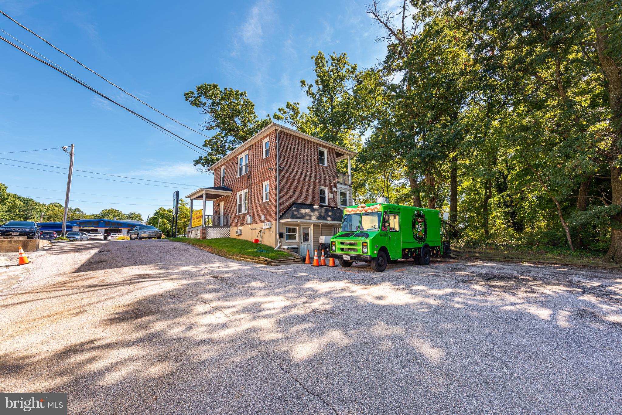 PRIME COMMERCIAL BUILDING WITH HIGH VISIBILITY CONSISTING OF 2 COMMERCIAL SPACES & 1 RESIDENTIAL UNIT! This all brick building is perfect to add to your rental portfolio or live in the apartment and work from one of the commercial spaces! The lower level currently used as a kitchen for a food truck and has a kitchen/prep area, dishwashing area, office/storage space, and half bath. The main level currently is used as salon with a waiting room, office, kitchen, and full bath and could also easily be converted to a 2nd residential unit. The 3rd floor has a 1 bedroom 1 bath apartment. There is plenty of off street parking at the rear of the property. Great location - close to Towson University, St. Joseph's Hospital, Belvedere Square, & more! Sold As-Is!