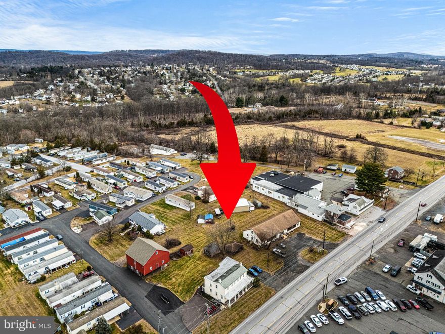 High Visibility, Mixed-Use Commercial property located along busy High Street/Ridge Pike (with over 16,000 cars per day) and just off the Sanatoga exit of Route 422.  This 2 +/- acre level and rectangular tract offers over 300 feet of frontage and includes a 4000 square foot retail building,  stately farmhouse converted into 4 residential units, an historic 1750 SF bank barn, and 1300 SF heated pole building.  Attractive Gateway Interchange Zoning offers a wide range of potential uses including retail, professional and financial office, automotive sales and service, restaurant including drive through and fast food, barbershop/salon, day care/preschool, pet service/veterinary, and many other potential applications.  The  present day  40x100 free-span commercial building has served as a popular antique store for over a century.  The current retail space lease ends in 2026.  The original farmhouse, situated on the very southeastern corner of the property, was converted in the 1990s  into 4 one-bedroom apartments, each with separate heat, electric, and central air utility services.  The apartments are fully occupied. The heated 1300 SF pole barn/workshop with two overhead garage doors,  and the vintage  1600 SF red bank barn with brownstone foundation represent potential additional income generating sources.  Whether you utilize the existing array of buildings for your business venture or construct a new structure on the property, the high visibility location combined with exceptional convenience to Route 422 create an ideal environment for growth.