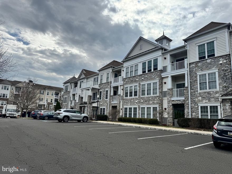 Beautiful 1st floor condo with 2 Bedrooms and 2 Full Baths and a fabulous open floor plan, with hardwood floors and custom millwork, located within the award-winning 55+ community of the Reserve at Gwynedd, offering an active community with outstanding amenities. This rarely offered, freshly painted, Dunnellon model is ideally situated on the first floor, providing effortless access to the exterior without the need for stairs or elevators, making daily living simple and convenient. The welcoming entrance Foyer opens to the Kitchen, Dining and Living Rooms, providing the perfect entertaining flow. The eat-in Kitchen features 42” cabinets, a range with 5-burner gas stove, microwave, new stainless double sink with new faucet and included refrigerator. A stunning Dining Room offers wainscoting, a tray ceiling and chandelier. The incredibly spacious Living Room features a sliding glass door opening to the Patio with utility closet. The Primary Suite with carpet features a tray ceiling, ceiling fan with light and includes a wall-mounted TV. The luxurious Primary Bath offers dual sinks, a soaking tub as well as a stall shower with tiled surround and leads to an extra-large, walk-in closet. The 2nd Bedroom with ceiling fan with light is also generously sized and is located adjacent to a 2nD Full Bath with soaking tub and shower, offering flexibility for guests or a home office. A spacious Laundry Room includes the washer and dryer plus utility sink and cabinets. Other special features include a WIFI thermostat with remote access and new hot water heater ($3000). This garden home also includes a deeded parking space and a storage unit in the underground garage plus unlimited exterior parking. Residents of The Reserve at Gwinnett enjoy exceptional amenities designed to enhance everyday living. The community features both indoor and outdoor pools, allowing you to swim year-round. Stay active in the fully equipped exercise room, or gather with neighbors and friends in the beautifully maintained community and game rooms. The professionally maintained grounds add to the welcoming and resort-like atmosphere. This community provides easy access to excellent shopping in the nearby Blue Bell shopping centers. It is also convenient to Wegmans, Trader Joe’s and Whole Foods. There is easy access to main routes including 202 and the PA turnpike. Enjoy 1st floor living in this low maintenance, vibrant community offering comfort, accessibility and outstanding amenities all at once.