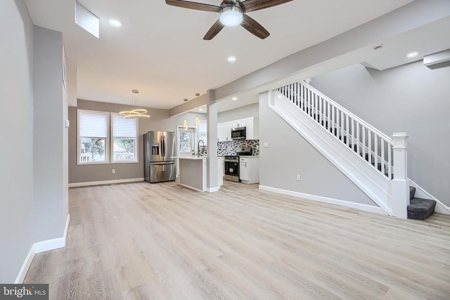 Wake up every morning, and say, I can’t believe I live in this amazing home! Open layout! Gorgeous kitchen with Calacatta Quartz countertop and island, coordinating backsplash, wood shaker cabinets, stainless steel appliances, including French door fridge. Upstairs bath is elegant and comfortable, with custom tilework and designer plumbing and lighting fixtures. Fully finished basement includes a family room and 4th bedroom, full bathroom with custom tile shower, and laundry room. This home features coordinated lighting and plumbing fixtures, new doors interior and exterior, new replacement windows, recessed lighting, HVAC system, Luxury vinyl plank flooring, driveway, covered porch, and new deck. You will love this home.