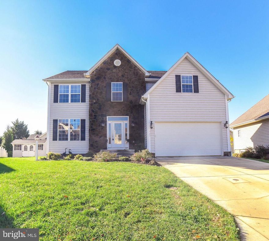 Beautifully maintained colonial in culdesac.  This home has been painstakingly cared for!! Glimmering hardwood flooring throughout main level. Kitchen features upgraded cabinetry, stainless steel appliances, and granite counters. Large Family Room off kitchen with  gas fireplace, and vaulted ceilings. Large Master bedroom with second gas fireplace, WIC,  bath with jetted tub and large shower plus double sinks. Three additional bedrooms are generously sized. Full basement with over 1100 sq ft of space has rough in for full bath and is ready for you to to finish as you like.  Deck off kitchen is maintenance free.  Top it off with a two car garage, and this one is ready to move right in!!