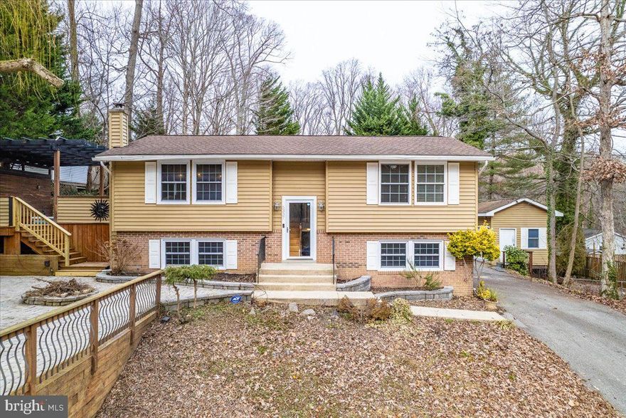 This is a absolute must see over 1800 square foot move in ready home in highly sought after Calvert Beach subdivision.  This house has been updated over the years to become a masterpiece.  The upper level has hardwood floors throughout.  The kitchen is magnificent with granite counters, high end cabinets, stainless steel appliances, backsplash, wine cooler and ceramic tile.  The family room is large and has built in shelves and ceramic accent wall perfect for daily family gatherings and entertaining friends and family.  The owner's suite is a must see, with 2 large areas, walk in closet, ceramic shower, large jacuzzi tub and high-end vanity.  Lower level boasts 2nd huge family/rec room area, large full bathroom and 2nd and 3rd bedrooms.  The outside is fantastic with oversized driveway perfect for multiple vehicles and or boat storage.  The front and side yard have gigantic deck and patio areas that are unbelievable.  The house is close to beaches and parks and just an awesome place to live.  House will not last.