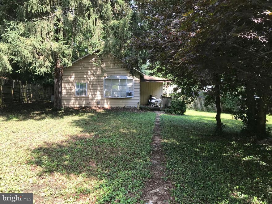 Located in the heart of Kensington, VALUE IN THE LAND ONLY.  The home is sold "Where is and as is,"  The structure seems solid but Enter at your own risk.