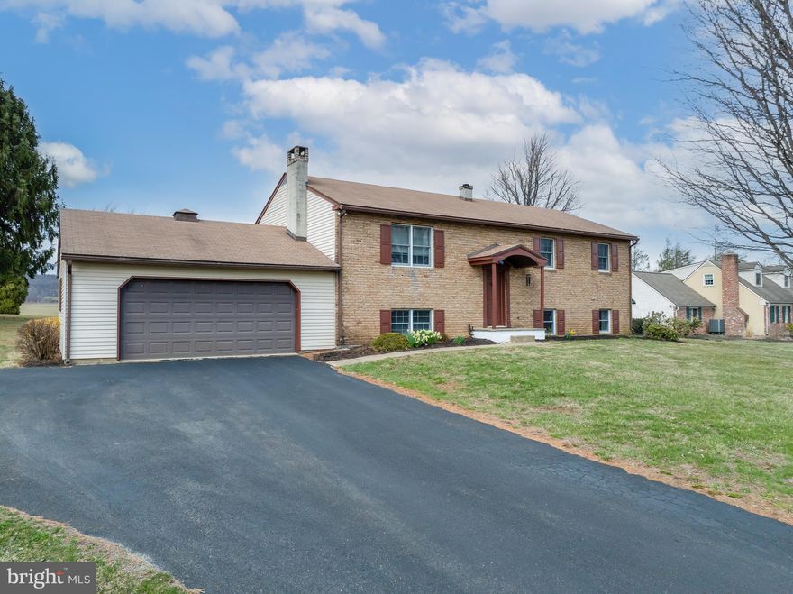 Welcome to the serene, private community of Lakeview Drive. Situated off Chestnut Tree Road, each house boasts a full one acre lot. Drive up to 75 Lakeview Drive, where a spacious front lawn with mature trees greets you. An expansive back yard with gorgeous farm land views completes this property. There is enough room for a pool, fire pit, sheds, you name it! As you walk inside this charming bi-level newly painted walls and freshly laid carpet welcome you inside. Up the stairs you have a large kitchen/dining combo area, which has crown moulding and large counter space. A wide open living room mirrors the kitchen and is large enough to host any gathering complete with a wood burning stove to stay comfortable and warm in the cold months. Down the hall you'll walk past a laundry shoot for the 3 bedrooms upstairs! The master bedroom boasts 2 closets and its own bathroom. Down the stairs, the two other large bedrooms fill the east side of the basement; while the west side boasts a large family room with a wood burning fireplace and a spacious storage room. The laundry room and the last bathroom are nestled in the middle to complete the basement. As you walk through the storage room you enter the massive 2 car garage. With  plenty of room on the walls to store your tools to work on projects, this garage will make it easy to get any work done on the house or yard. A man door on the back of the garage allows comfortable access to the back yard when in need to get something. With Struble lake minutes down the street, and a quiet, peaceful road to run or walk, you don't want to miss this opportunity  to join the community on Lakeview Drive!