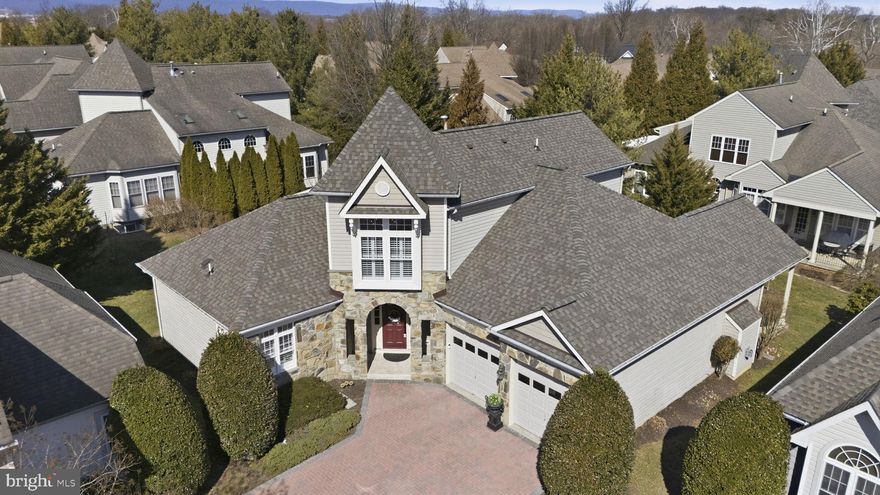 All NEW in the last 4 years:  ROOF (2026), new HVAC, new kitchen, newly finished lower level with new  4th bedroom including addition of legal ingress/egress window, new 3RD full bath, new lower level family room with added storage closets, new hardwood floors replace any formerly carpeted rooms, plus all new and existing floors refinished, all new custom Plantation Shutters, fully renovated 2nd floor bath, all new lighting thru the home, new  custom wainscotting added in foyer, living and dining rooms, and 1st fl hallway, renovated/updated staircase with custom spindles, MYQ garage door opener, all new hardware thru the house, repainted interiors.
Located on Mill Island, a quiet neighborhood bounded on one side by the Monocacy River and the other by Tuscarora Creek; once you cross the bridge onto the island leave your cares behind. No thru traffic, miles of paved marsh trails in a protected wildlife area to jog or stroll offer a sense of quiet solitude. A 1 block large park with fishpond and waterfall is only a 1/2 block walk away for quiet enjoyment; there is also an area to launch kayaks on the Monocacy side. Resort amenities include a clubhouse featuring areas to lounge and entertain, a gym, Game room, locker rooms, library, adult pool, kids pool, lap pool, tennis courts and putting green. Stroll to the Worman's Mill Town Center for indoor and outdoor dining at local restaurants, bakery, ice cream shop, convenience stores, a town square with outdoor weekend summer concerts and food trucks. This lovingly maintained home with 3871 finished sq ft of living is in mint condition with impeccable maintenance and is designed to live like a rancher with an expansive main level primary suite featuring tray ceilings, hardwood flooring, walk-in closet with organizers, huge spa bath with soaking tub, walk-in shower, and separate vanities. The great room offers 18' ceilings, gas fireplace flanked by French doors which open to a very private stone patio. The spacious island kitchen offers hardwood floors, gourmet appliances, island, coffee bar, a breakfast room, and is open to the family room with a 2nd gas fireplace flanked by custom built-ins and opens to a covered rear porch. Located on one of the Palentine brick courtyards with no thru traffic enjoy quiet, privacy, and many services such as exterior front trimming, mulching, grass mowing, curb side trash pick-up, and snow removal up to your front door and driveway to garage doors. Mill Island is bike and pedestrian friendly for residents with little traffic and plenty of sidewalks, pocket parks with ponds, fountains and overlook sitting area on the Monocacy. A truly welcoming community.