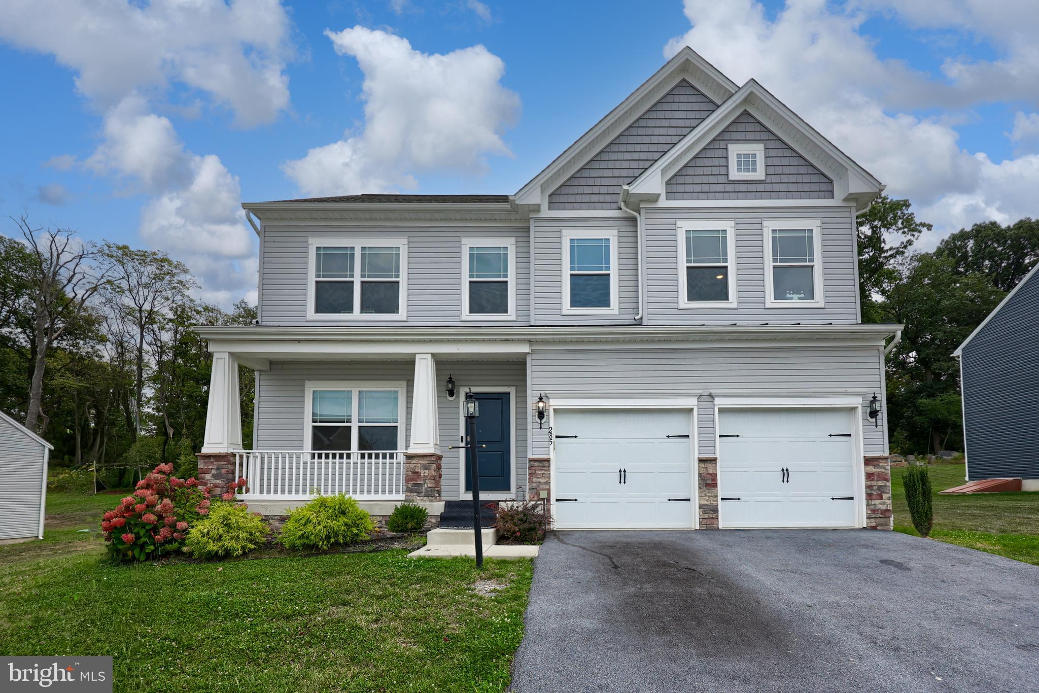 Welcome to this nearly new 4-bedroom home offering modern style, comfort, and a serene setting. You will find a finished lower level - perfect for additional living space. The open and bright layout features a spacious living area that flows seamlessly into the dining room and kitchen, perfect for everyday living and entertaining. Upstairs, you’ll find four generously sized bedrooms including a beautiful primary suite with a private bath. Step outside to enjoy the peaceful outdoor area—ideal for gatherings, relaxation, or play. The home backs up to a tree line, providing privacy and a tranquil backdrop. With its like-new condition, thoughtful design, and inviting outdoor space, this home is move-in ready and waiting for you.