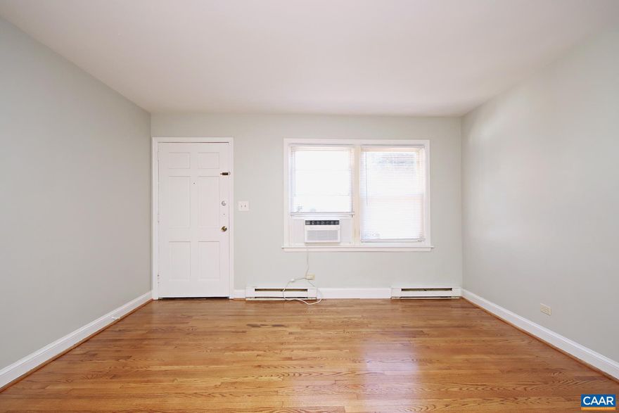 Available May 22nd for the 26-'27 Academic Year. This student-friendly 1 bedroom, 1 bath apartment offers a prime location near the University of Virginia main grounds, graduate schools, and medical center, as well as the Emmett/Ivy corridor. Walkable to local favorites - Foods of All Nations, Ivy Provisions, Vivace, and more! Just minutes from the School of Data Science, Scott Stadium, Disharoon Park, and the JPJ Arena.  This 500 sqft ground-level apartment offers hardwood floors, a living room with space for a small kitchen table, a galley-style kitchen with a refrigerator and an electric oven, a nicely sized bedroom with closet space, and a full bath with a combo tub/shower. Two window ac units are included.  Rent includes: water/sewer, and trash (dumpster) collection. There is a shared laundry room within the building with two commercial-grade washers and two regular dryers. One parking space is available per apartment. No pets allowed.