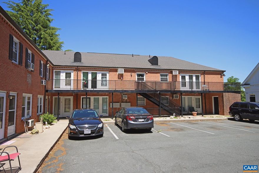 Available May 22nd for the 26-'27 Academic Year. This student-friendly 1 bedroom, 1 bath apartment offers a prime location near the University of Virginia main grounds, graduate schools, and medical center, as well as the Emmett/Ivy corridor. Walkable to local favorites - Foods of All Nations, Ivy Provisions, Vivace, and more! Just minutes from the School of Data Science, Scott Stadium, Disharoon Park, and the JPJ Arena.  This 500 sqft ground-level apartment offers hardwood floors, a living room with space for a small kitchen table, a galley-style kitchen with a refrigerator and an electric oven, a nicely sized bedroom with closet space, and a full bath with a combo tub/shower. Two window ac units are included.  Rent includes: water/sewer, and trash (dumpster) collection. There is a shared laundry room within the building with two commercial-grade washers and two regular dryers. One parking space is available per apartment. No pets allowed.