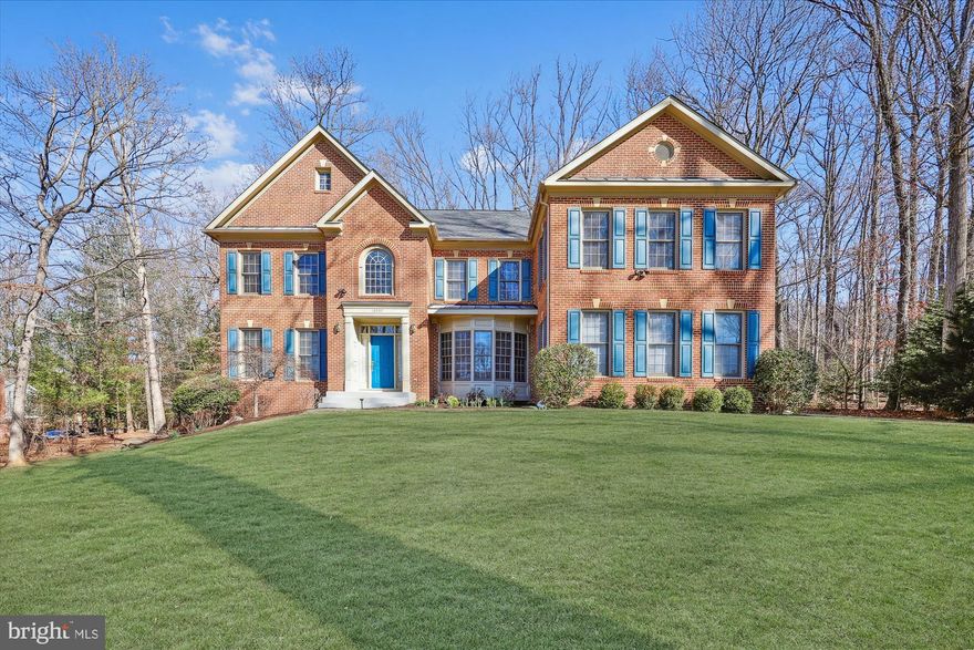 Fall in love with 13027 Cleveland Drive, nestled on a private 1-acre lot in the desirable Glen Hills neighborhood of Rockville. This beautifully presented 7,402-square-foot Oakton model CRAFTMARK home showcases meticulous attention to detail, blending elegant finishes with modern amenities.

Numerous upgrades include a NEW ROOF (2023), NEW KITCHEN APPLIANCES (2024), NEW HVAC (2024), KITCHEN RENOVATION (2014), FULLY FINISHED WALK-OUT BASEMENT WITH KITCHENETTE (2009), NEW HOT WATER HEATER (2017), UPGRADED WELL WATER TREATMENT/FILTRATION SYSTEM (2018), NEW CARPET (2025), OUTDOOR MOTION SENSORS & LIGHTS (2025), and a DECK ADDITION (2009). The expansive, private backyard and oversized walk-down deck are perfect for both relaxing and entertaining.

Spanning three fully finished levels, this home boasts a grand 2-story foyer, front and back staircases, hardwood floors, extensive millwork, 10' ceilings, Palladian windows, built-in bookshelves, recessed lighting, and a convenient mudroom/laundry room off the three-car garage.

At the heart of the home, the updated gourmet kitchen boasts a center island with a JennAir grill cooktop and breakfast bar, a separate gas range, cherry wood cabinetry, stainless steel appliances, granite countertops, contemporary tile backsplash, pendant lighting and a breakfast area. The kitchen flows seamlessly into a light-filled family room. The main level also offers formal living and dining rooms, an office, a mudroom/laundry room, and a powder room.

Upstairs, you’ll find five spacious bedrooms and three full bathrooms. The owner’s suite is a true retreat, providing a sitting room, a walk-in closet, and a luxurious en-suite bathroom with a modern tile surround, soaking tub, separate shower, and dual vanities.

The walk-out lower level, completed in 2009, offers versatile space ideal for use as an in-law suite, lounge, media room, or more. It features a kitchenette, a spacious recreation room, a full bathroom, and a bedroom, along with two additional bonus rooms with closets—currently utilized as a guest room (with transom windows) and an art studio. The utility room provides abundant storage space.

Ideally located with easy access to major commuter routes, this home is close to numerous parks, recreation options, and nationally rated golf courses—perfect for outdoor enthusiasts. Top-rated Montgomery County schools further enhance its appeal.

Don’t miss this incredible opportunity to own in one of the DC area’s most sought-after communities!