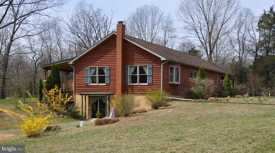 LIKE NEW CUSTOM BUILT CEDAR SIDING RANCHER BUILT IN 2005 AND SITUATED ON 6.30 ACRES.  THE HOME WAS DESIGNED FOR 3 BEDROOMS BUT IS CURRENTLY TWO WITH 2 & 1/2 BATHS. CAN BE CONVERTED INTO THREE BEDROOMS EASILY.  OPEN FLOOR PLAN. CERAMIC TILE FLOORS IN THE BATHROOMS. SOLID MAPLE HARDWOOD FLOORS THROUGHOUT. 8 FOOT PANTRY. HOUSE IS 30' X 52' WITH FULL WALKOUT BASEMENT. A CHIMNEY FOR FOR CONVENIENCE.  ATTACHED UNDER ROOF 2 CAR CARPORT. SIT ON THE 12' X 20 ' COVERED DECK AND ENJOY WATCHING THE WILDLIFE. HEAT PUMP IS A TRANE VARIABLE SPEED 14 CR FOR HEATING AND COOLING. ENERGY EFFICIENT ANDERSON THERMO PANE WINDOWS. LOW ENERGY BILLS. DRILLED WELL IS 16 GPM. STANDARD SEPTIC TANK WITH 3 LINES. 3 SHEDS, A 12' X 20', A 10' X 20' (WITH ATTACHED 10' X 10 ' STALL AND AVIARY). A 12' X 24 ' 2 STALL RUN-IN SHED WITH ATTACHED GOAT FENCE 100' X 100' X 50' X 50" CURRENTLY USED AS AN ORGANIC GARDEN. A 8' X 12 ' GREEN HOUSE. SEVERAL FLOWER BEDS AROUND. THE SUBDIVISION HAS 25 ACRES AROUND SLEEPY CREEK FOR HIKING, FISHING AND SWIMMING ENJOYMENT. ALSO A POND TO RELAX BY. ENVIRONMENTALLY FRIENDLY HOME. AN ELECTRIC GATED LANE. JUST 15 MINUTES FROM HANCOCK MD AND I-70. POTOMAC RIVER NEAR BY. HOME COMES WITH HOME PROTECTION PLAN.