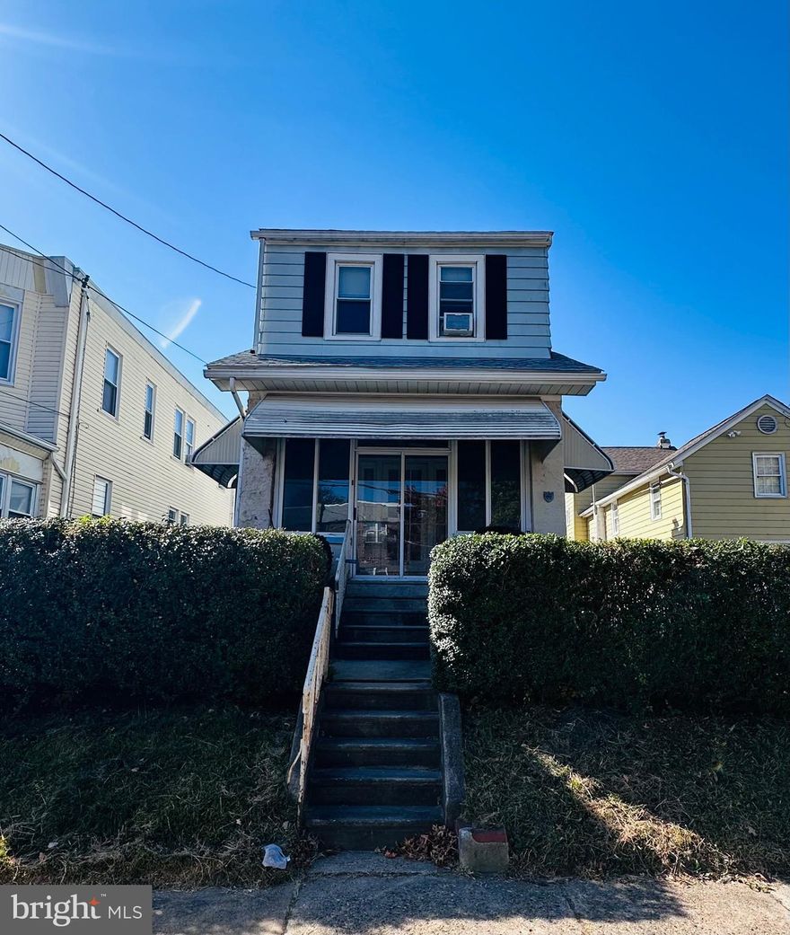 A true diamond in the rough! This spacious homes sits on an amazing block. Original hardwood flooring, replacement windows, original kitchen, 3 bedrooms and a hall bath are featured. There is also a nice large back yard off the kitchen . Full basement also. Great investment property at an amazing price for the area! Being sold in as is condition