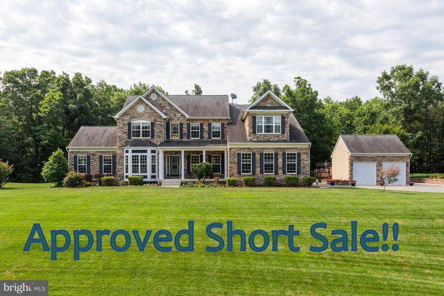 APPROVED SHORT SALE ! From the open floor plan to the gourmet kitchen, this home has it ALL! Fam Rm w/gas FP, Formal DR & LR, 2 office/dens on main lvl. Mstr Ste w/sitting area, gas FP, lux BA w/custom walk in shwr, dual sinks & soak tub. Media Rm, RecRm, 5th BR & full ba on lower lvl. Fenced in backyard oasis w/pool, hot tub, large patio & extensive landscaping! 2 car attached & detached garage.