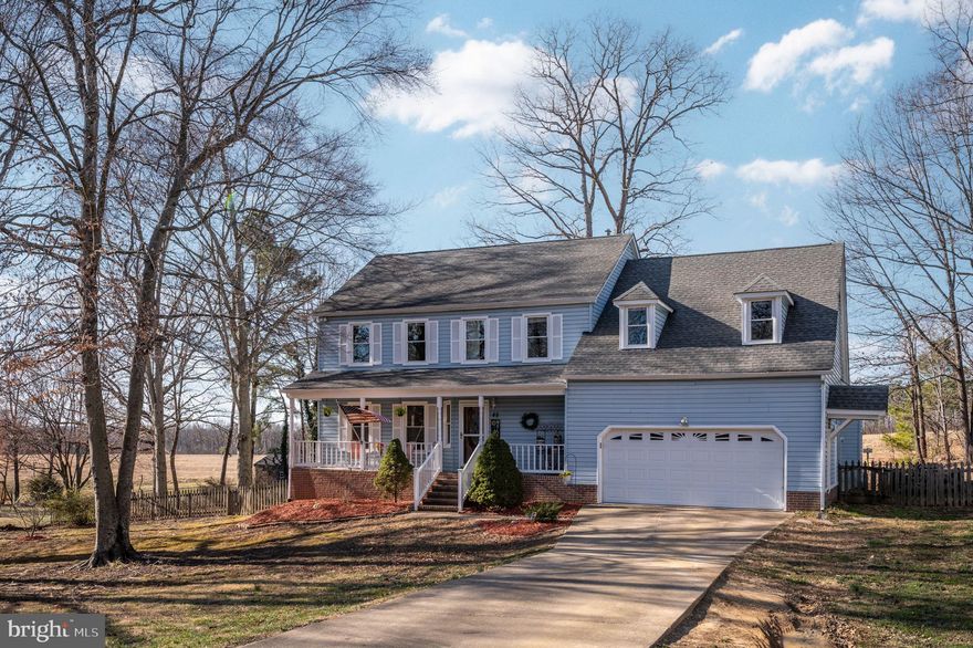 Colonial charm and  convenience, this home is close to Downtown Fredericksburg, the Train Station and I95 in Stafford County! This home sits in the Blythedale neighborhood with NO HOA. Relax on your front porch in the evening. Heading inside, note the new LVP flooring, the refreshed wooden front door, stairwell and paint. The family room boasts cathedral ceilings with skylights. The fireplace has been converted to gas. The kitchen includes painted cabinets and a large sink overlooking the backyard which backs to pasture. There are also 2 pantries for your convenience. Upstairs are the  5 bedrooms and two full baths. There is also a walk-up attic for amazing storage. The roof, HVAC, and hot water heater have been regularly maintained and are newer.  The large driveway can park multiple cars. The two-car garage, which includes built-in overhead storage and a side door. The back yard is accessible by 2 gates and off the kitchen.  This is a must see.