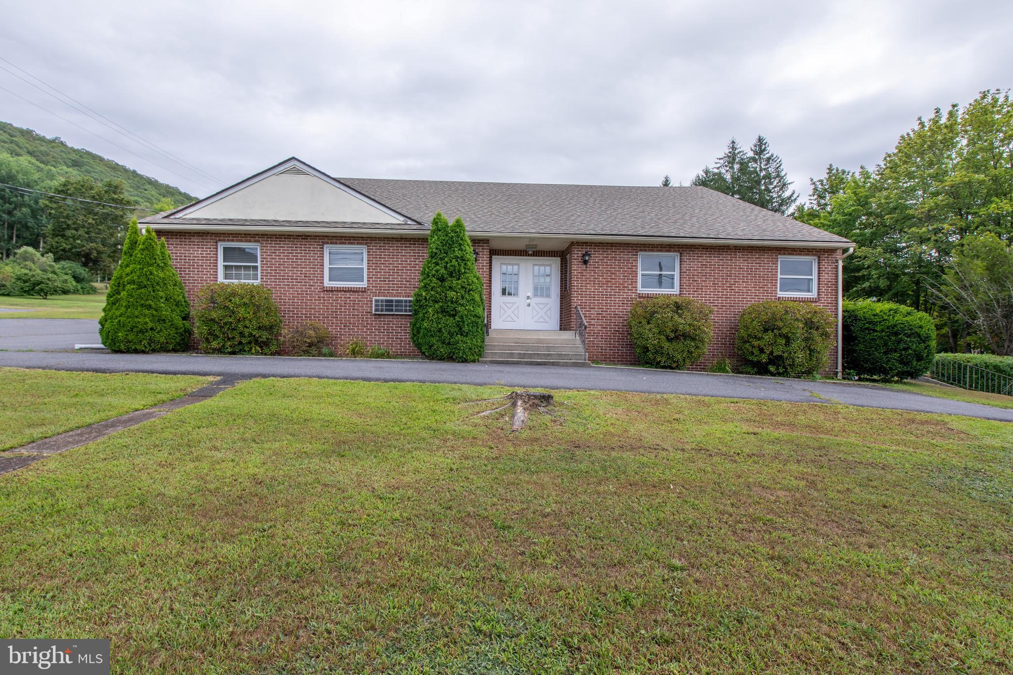 With over 4000 sq ft of well maintained, above grade usable space, and HC zoning, this property offers plenty of options! High visibility location along busy Rt. 309. Currently the main level is set-up as a turnkey daycare facility. The second floor, which may be accessed from either inside the building or from its own exterior entrance, has four private rooms as well as a storage area. The heated lower level is zoned for recreational and educational activities; it also has kitchen facilities and additional 2500+ sq ft Propane hot air heat, central (and some ductless) AC. New well installed in February of 2024. A monitored fire system was recently added to the building. A large parking lot, in the rear of the building, gives the potential to park 50 cars. Perfect opportunity for your business!