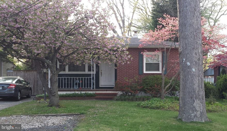 Enjoy your new home on a quiet street.  This home features 3 bedrooms, eat in kitchen, living room and a large sunroom/family room on the first level.  The lower level has a partially finished room, full bathroom and storage area.  Well maintained.  Nice level lot. Wood Stove in as is condition.