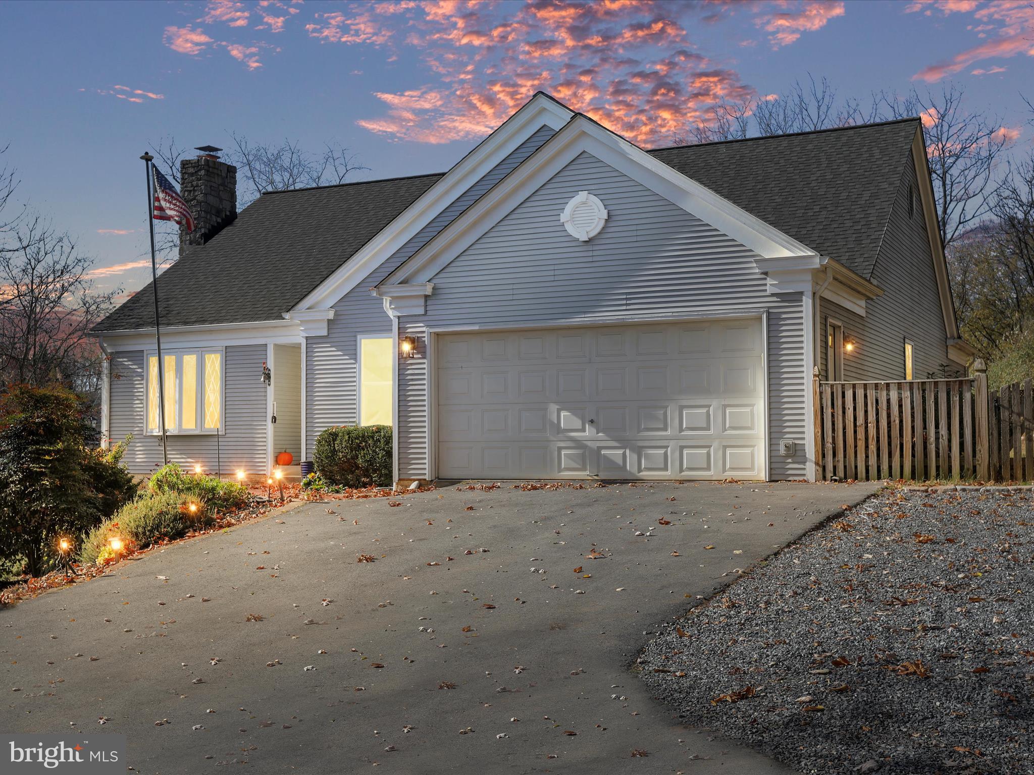 Experience the perfect blend of comfort and convenience in this 3-bedroom, 2.5-bathroom rancher. Featuring a beautifully finished basement and a spacious 2-car attached garage, this home is ideally situated near restaurants, shopping, commuter routes, and the MARC train, providing easy access to urban amenities while maintaining a peaceful suburban feel. The inviting primary suite includes a comfortable sitting room and a private bathroom, creating a tranquil retreat within your home. The family room, with its cathedral ceilings and cozy wood-burning fireplace, offers a dramatic focal point and a warm space for gatherings. The kitchen boasts stylish quartz countertops and modern fixtures, making it both functional and visually appealing. The property’s aesthetic extends outdoors with a private, tree-lined driveway leading to a welcoming deck and a fully fenced yard, perfect for secure and private outdoor enjoyment. This rancher combines timeless style with practical living solutions, making it an ideal choice for those seeking a single-level home without sacrificing space or luxury. Whether hosting a gathering, enjoying a quiet evening by the fireplace, or relaxing on the deck, this home offers a variety of spaces for entertainment and leisure in a beautifully landscaped setting.