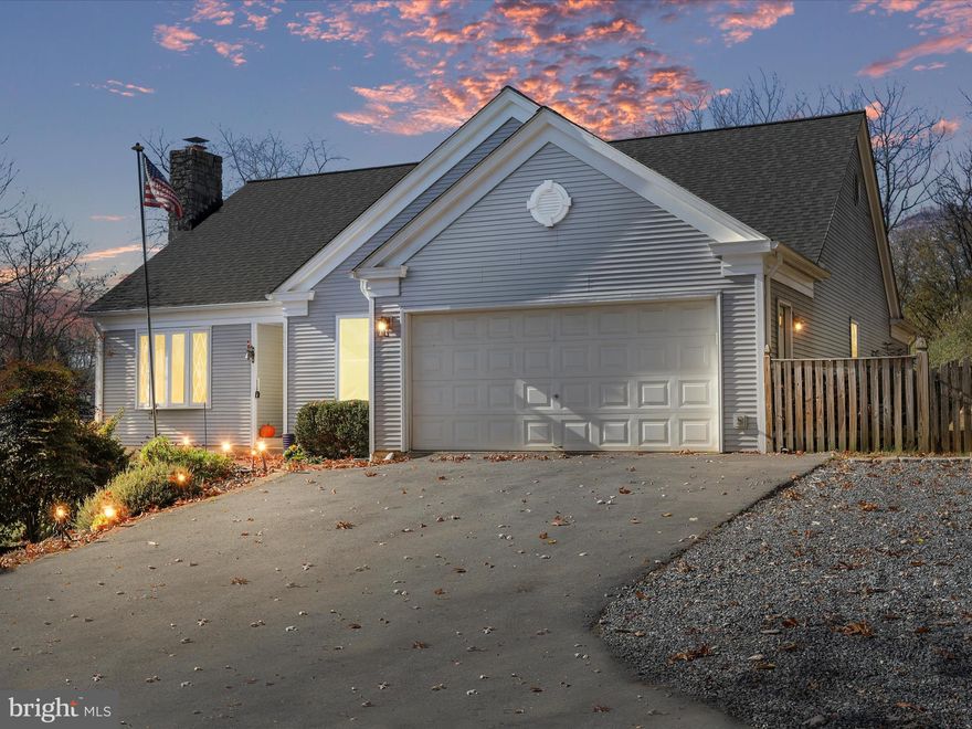 Experience the perfect blend of comfort and convenience in this 3-bedroom, 2.5-bathroom rancher. Featuring a beautifully finished basement and a spacious 2-car attached garage, this home is ideally situated near restaurants, shopping, commuter routes, and the MARC train, providing easy access to urban amenities while maintaining a peaceful suburban feel.  The inviting primary suite includes a comfortable sitting room and a private bathroom, creating a tranquil retreat within your home. The family room, with its cathedral ceilings and cozy wood-burning fireplace, offers a dramatic focal point and a warm space for gatherings.  The kitchen boasts stylish quartz countertops and modern fixtures, making it both functional and visually appealing. The property’s aesthetic extends outdoors with a private, tree-lined driveway leading to a welcoming deck and a fully fenced yard, perfect for secure and private outdoor enjoyment.  This rancher combines timeless style with practical living solutions, making it an ideal choice for those seeking a single-level home without sacrificing space or luxury. Whether hosting a gathering, enjoying a quiet evening by the fireplace, or relaxing on the deck, this home offers a variety of spaces for entertainment and leisure in a beautifully landscaped setting.