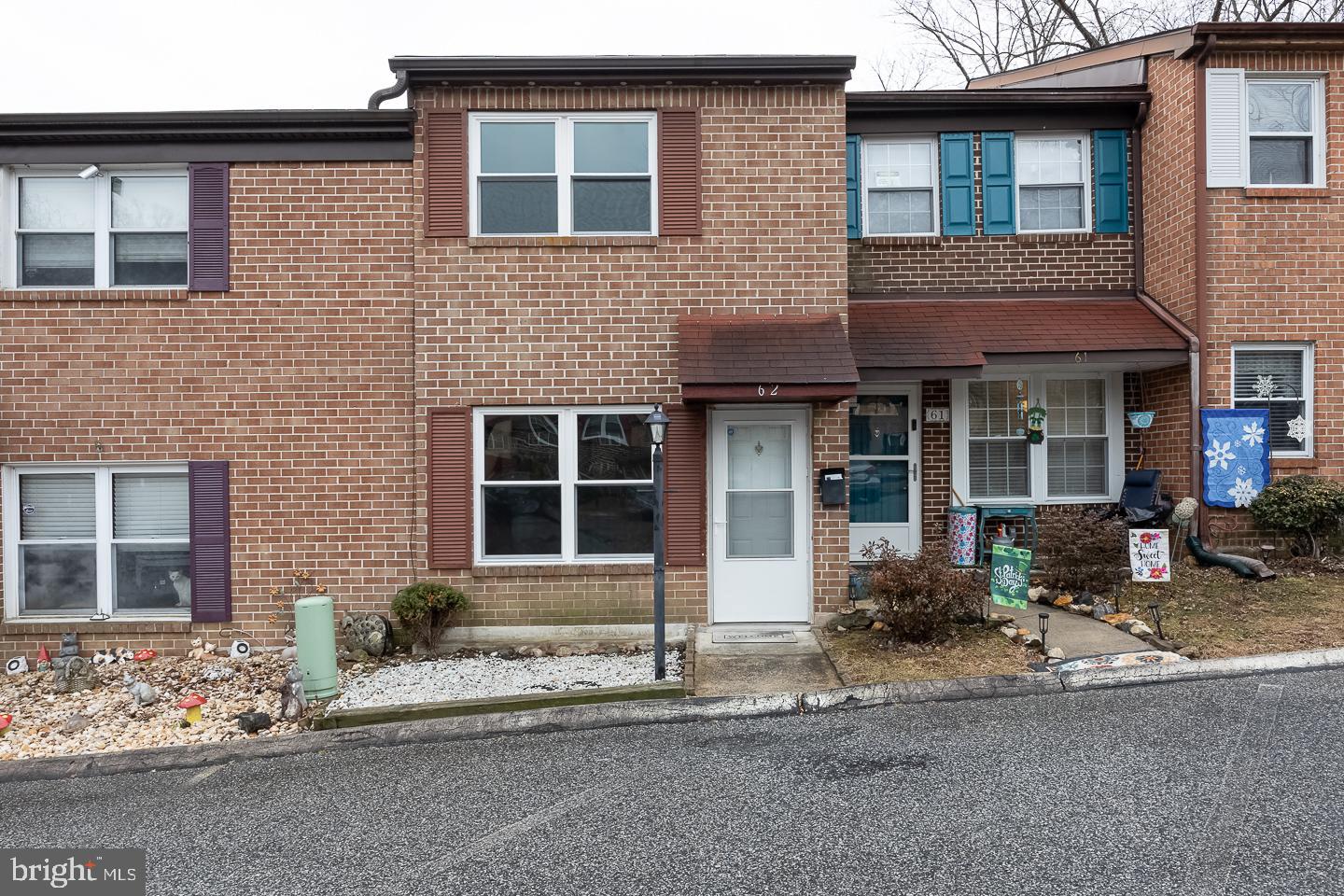 Back on the market due to buyers getting cold feet! Home has been fully inspected & cleared appraisal! BRAND NEW Electrical panel installed! Welcome to this charming brick colonial townhome nestled in the desirable Parkside Borough! Step inside to be greeted by bright hardwood flooring that flows through the spacious living room, complemented by a fresh, neutral color palette. Down the hall, you'll find a generously sized dining area with sliding doors leading to the rear of the home—perfect for seamless indoor-outdoor living. The adjoining galley-style kitchen offers a functional layout with a pass-through countertop featuring island seating, white cabinetry, coordinating white appliances, contrasting countertops, and a stylish tile backsplash. A convenient powder room completes the first floor. Upstairs, you’ll find two well-appointed bedrooms, each filled with natural light, boasting hardwood flooring and ample closet space. The hall bathroom offers added convenience, complete with an upper-floor laundry area for effortless everyday living. Extend your space into the walk up attic which is perfect for storage or could be finished for extra living area. Located in a prime spot with easy access to transportation, shopping centers, and schools, this home is a fantastic opportunity for those seeking comfort and convenience in a sought-after community. Don’t miss your chance—schedule a showing today!