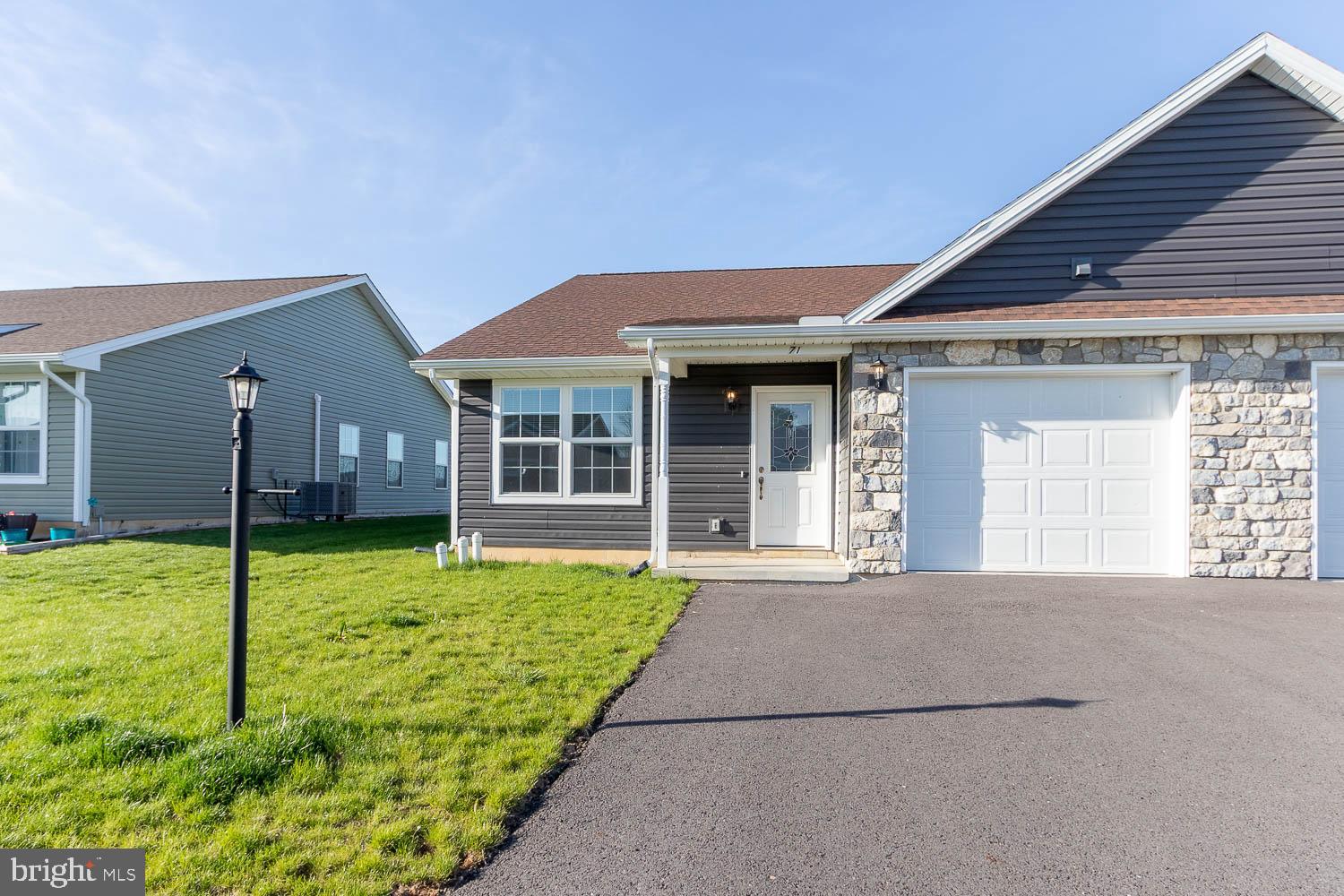 Enjoy true 1-floor living with farm field views at 71 Pacific Avenue in Milroy! This immaculately maintained home offers upscale living in a convenient and a rural setting. You will appreciate the fully equipped kitchen with white cabinets, stainless steel appliances, and an abundance of natural light from the glass slider off of the expansive living room leading out to a concrete patio overlooking neighboring farm fields. The massive, primary bedroom boasts a private full bathroom with dual vanity, tub shower, and a walk-in closet. Two additional bedrooms, with ample closet space, and a full bathroom round out the home. Additional highlights include central air, electric heat pump, PEX plumbing, open-concept floor plan, secluded laundry/mudroom, and an attached, 1-car garage. Conveniently located 10 minutes to Lewistown and only 30 minutes to State College & Penn State campus.