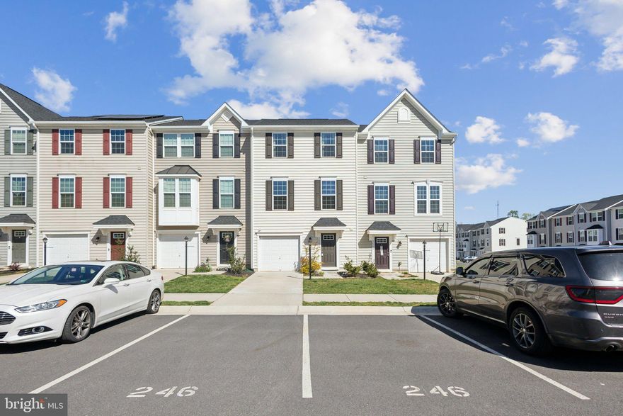 Price Improvement on this Move-In Ready Garage Townhome in sought-after Wilderness Shores neighborhood.  Back-on-market due to buyer finances. This "like new" home built in 2021,  offers 3 spacious levels,  3 bedrooms, 2.5 baths, a convenient garage, large driveway and 2 assigned parking spots right in front.  This is your chance to own a new home in Wilderness Shores without the wait or the higher prices of new construction.  With 9' ceilings and tons of windows, the main level features the best in modern living with an open-concept design.  The kitchen sparkles with white cabinetry, an oversized prep island, stainless steel appliances, luxury vinyl floors and a light-filled dining area with sliding doors to your future deck.  The large family room off the kitchen allows for perfect entertaining, gatherings with friends and family or the perfect spot to watch a show.  Upstairs is an elegant owner's retreat with high ceilings, a fabulous walk-in closet and an owner's bath with an oversized tiled shower and double shower heads.  The two gracious guest rooms offer plenty of space and storage and share a generous hall bath and the laundry room with full-size washer and dryer offers the ultimate in convenience. The lower level maximizes function with a large multipurpose space perfect for rec room, home theater, man-cave, home office or play room.  This space offers recessed lights and a convenient powder room along with walkout sliding glass doors that lead to a private rear yard fenced on two sides,  Wilderness Shores is a great choice for an easy commute to Fredericksburg, and employments centers in Prince William, Stafford and Fairfax Counties.  The community has great amenities and is just minutes to dining and shopping options. Don't miss this chance to own this turnkey home!