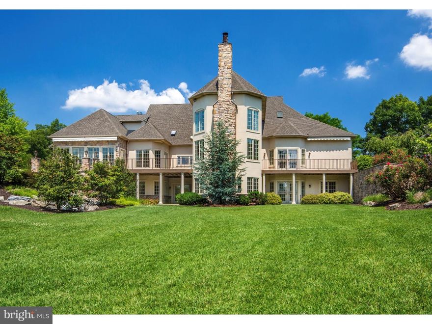 Sunlight filters through the trees and the sounds of a waterfall blend with whispering woods as you travel the private road to Stones Crossing. Set on 5.8 pristine acres in convenient and desirable Center Valley, this gracious home offers a carefully crafted interior and an exterior of decks and terraces with expansive views of the peaceful natural surroundings.       A designer's touch brings fresh, vibrant accents and colors to the immaculate living space. Graceful proportions, gentle curves, soaring ceilings, and copious windows highlight unforgettable rooms. Replete with built ins, polished wood floors, and a floor-to-ceiling stone fireplace, the great room stands at the heart of the main level. Equally compelling is the stunning kitchen with French-styled cabinets, baking station, farmhouse sink and Brazilian granite surfaces. A captivating sunroom provides a venue for quiet moments to read or meditate. There are four luxurious en suite bedrooms, including a first floor master's suite with private dressing room, French doors to a balcony, and an adjacent library warmed by Brazilian cherry floors and patio access. The fully finished walkout lower level has the option of elevator access and features a second kitchen, fifth full bath, and flexible space for a guest suite, hobby room or fitness area.        Multi-zoned heating with heated floors, zoned cooling, solid wood doors throughout, an attached three-car garage and a 24'x 32' detached barn for storing automobiles or recreational vehicles are amenities to appreciate in this unparalleled home.