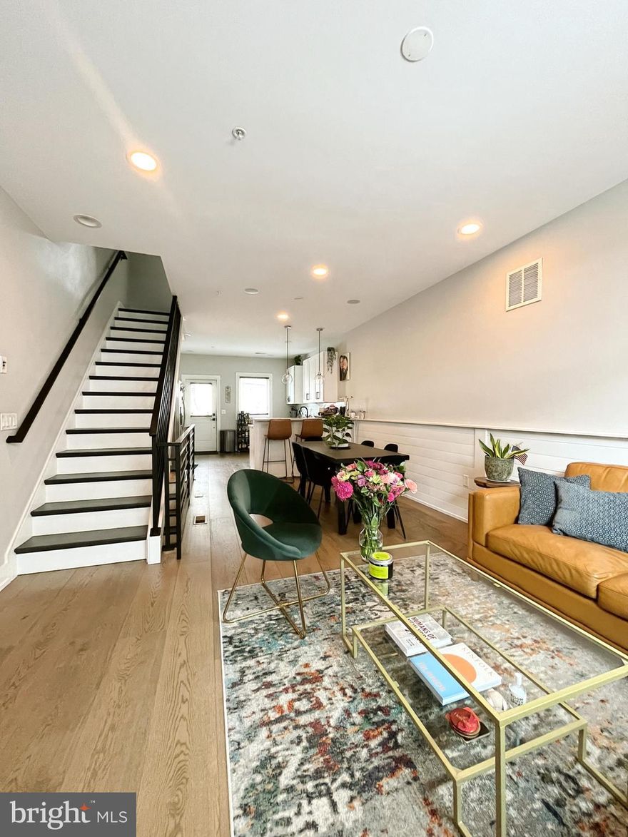 Welcome to 1416 S. Taylor Street, a beautifully designed 3-story home in the vibrant Point Breeze neighborhood of Philadelphia. This modern townhouse features an open-concept living and dining area with a contemporary kitchen that includes white shaker cabinets, stainless steel appliances, quartz countertops, and a breakfast bar. A private patio off the first floor offers the perfect spot for outdoor relaxation.

The second floor includes two spacious bedrooms with built-in shelving and a full bathroom. The third-floor master suite offers privacy with a walk-in closet, two additional custom closets, and a luxurious bathroom with a double vanity and a frameless glass shower. Enjoy stunning, unobstructed views of the city skyline from the fiberglass rooftop deck.

The fully finished basement includes a bedroom, full bath, and laundry area, providing flexibility for additional living space. Hardwood floors, recessed LED lighting, and a built-in sound system are featured throughout. A park is located next door.
Parking is easy on the street, and tenants are responsible for all utilities. Pets are considered on a case-by-case basis. Located in a sought-after area, this home is close to dining, shopping, and iconic Philadelphia attractions.