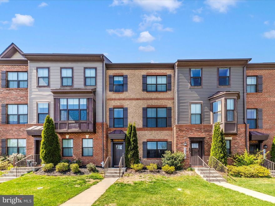 Welcome home!! Distinct from the standard contemporary builds of Clarksburg Square, this impressive 4-level townhome features 4 bedrooms, 3 full bathrooms, 1 half bath, and an abundance of upgrades, all nestled in a vibrant, amenity-rich community.

Situated on a charming, tree-lined street surrounded by sidewalks and green space, this home offers a warm neighborhood feel with convenient access to Clarksburg Village, Clarksburg Premium Outlets, parks, and major commuter routes. The Clarksburg Square community offers residents an exceptional lifestyle with access to a clubhouse, pool, fitness center, dog park, tot lot, playground, and more—perfect for every stage of life.

The curb appeal is matched by a low-maintenance front yard, while a composite deck provides a serene setting for outdoor dining, grilling, or simply enjoying the fresh air.

Inside, the home greets you with wide-plank engineered hardwood floors and a bright, open-concept layout that flows effortlessly from room to room. The gourmet kitchen is a true showpiece, featuring quartz countertops, a designer stone backsplash, premium stainless steel appliances, a central island, and a two-tier peninsula ideal for casual dining and entertaining.

The sun-filled living room, with its exposed ceiling beams, creates a welcoming ambiance and an ideal space for everyday living or gatherings.

Upstairs, the primary suite offers a peaceful retreat with a spacious walk-in closet and an en suite bath featuring a walk-in shower. Two additional bedrooms and a full bath complete the upper level, along with a brand-new washer and dryer for added convenience.

The ground level includes a fourth bedroom and a third full bathroom, offering privacy and flexibility—perfect for guests, a home office, or multi-generational living.

The top-floor loft adds another dimension to the home with its versatility—ideal for a home gym, creative studio, lounge, or office. Step outside to the expansive rooftop terrace, a true highlight, where you can enjoy sunset views, entertain under the stars, or simply relax in your own private outdoor oasis. 

A two-car garage with a wide driveway provides plenty of parking and storage, while solar panels bring eco-conscious efficiency and long-term savings.

This beautifully maintained home delivers space, style, and location, all within one of Clarksburg’s most sought-after communities! Schedule your private tour today and see why this isn’t just a place to live — it’s a place to love. ❤️