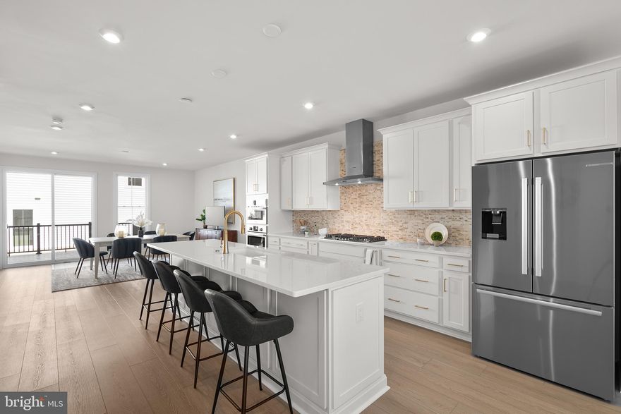 Brand new elevator style luxury Van Metre Townhouse with 3 bedrooms and 2.5 bathrooms in the Active Adults 55+ community of Lexington Square, ready for IMMEDIATE DELIVERY. The gorgeous great room with a designer kitchen includes dining space and a statement fireplace. It has access to a huge deck overlooking the open common space and backyard. The open concept gourmet kitchen features stainless steel appliances (including a 5 burner Bosh cooktop with chimney hood), a gigantic island, pantry with solid shelving, upgraded white backsplash, and incredible quartz countertops. This spacious main level also includes a study with a lovely window, perfect for every-day use, as well as an abundance of natural light throughout with beautiful, recessed lighting and 10’ ceilings that create plenty of room for life’s celebrations. The upper level has all 3 bright and spacious bedrooms. The primary bedroom steals the show with its vaulted ceilings, huge walk-in closet, recessed lighting, and a spa inspired bathroom. This primary bathroom includes dual vanities (soft close cabinets), more incredible quartz countertops, and an accessible/beautiful roll-in frameless shower (floor to ceiling tile and built-in seat). There’s more natural light throughout the 2 additional bedrooms which have stain resistant carpeting, walk-in closets, and plenty of space to relax. The second full bath is gorgeous and functional with a tub! The lower level has the main entrance and a massive recreation room that is excellent for entertainment. This is the perfect home for life’s milestones with several accessibility features, including a private elevator. There are also many sustainability features like an instant tankless water heater, structured home wiring system, and it’s ready for solar panels! Enjoy peace of mind with the builder’s post-closing warranty and move in today. This boutique community is designed with a smaller, close-knit feel to encourage meaningful relationships with neighbors. Enjoy thoughtfully curated amenities including walking trails to Lansdowne Woods, a pollinator garden close by a County preservation area, and active recreation areas. Every detail at Lexington Square has been designed to offer comfort and ease, creating the perfect backdrop for vibrant living. Perfectly situated just off Route 7, you are just moments away from One Loudoun, Belmont Chase Town Center, Lansdowne, and all the essential shopping and dining Ashburn offers. Also conveniently located close to the Metro’s Silver Line, Dulles International Airport, commuter routes, and health centers including Inova, making it a prime destination for those seeking a well-connected and vibrant lifestyle.
Take advantage of $1,000 for closing costs by choosing Intercoastal Mortgage and Walker Title.