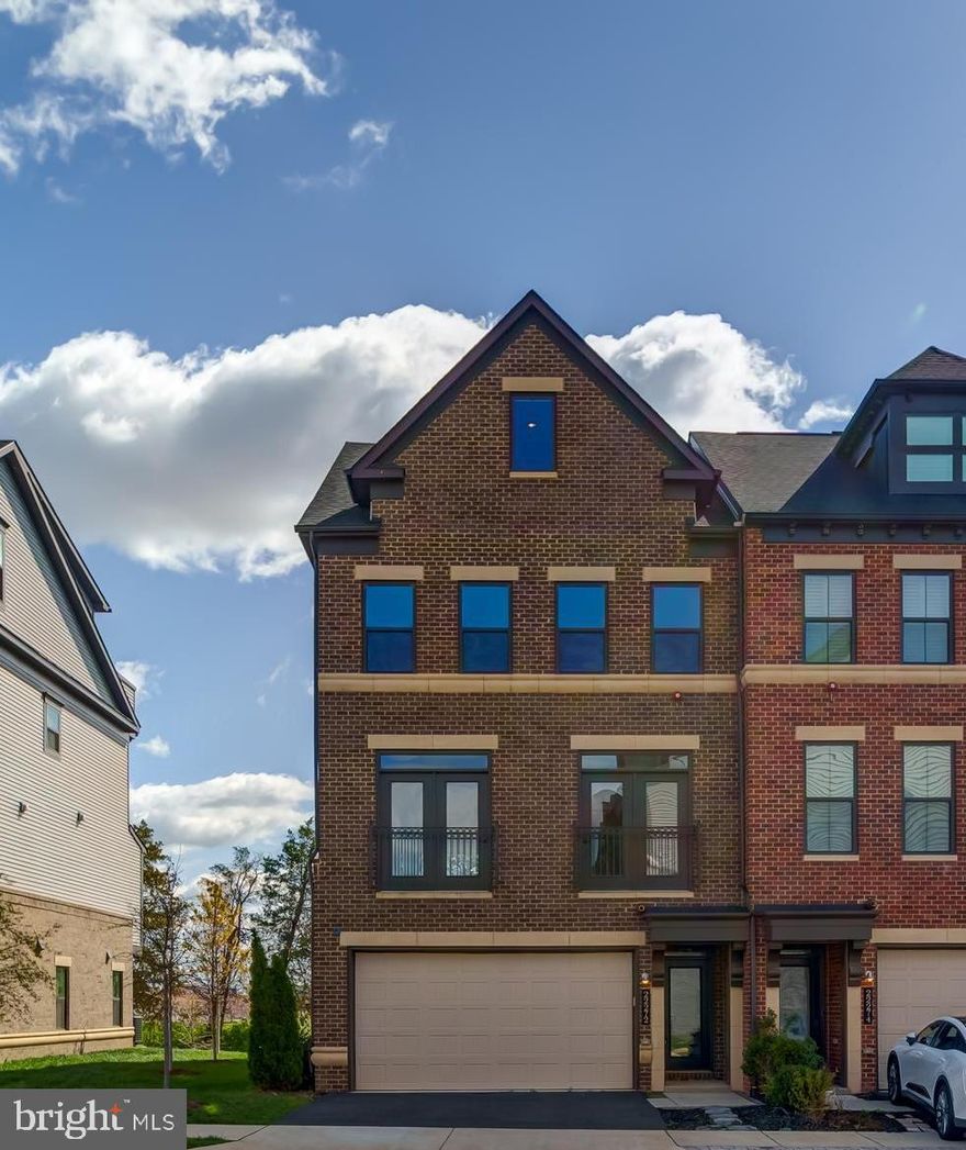 Experience over 4,100 square feet of thoughtfully upgraded living space in this spacious 4-level townhome, ideally located just minutes from the Ashburn Metro! Boasting 4 bedrooms, 4.5 bathrooms, and multiple outdoor escapes—including a secluded patio, balconies, and a spectacular rooftop terrace—this home offers luxury and comfort at every turn.

The entry level opens to a generous recreation room and a full bathroom adorned with granite countertops and stylish tile flooring. Sliding glass doors lead to a private patio with uninterrupted views and no rear neighbors, creating a serene and secluded outdoor retreat.

The main level features a bright and spacious open-concept layout. At the center of the home is a stunning gourmet kitchen, highlighted by a generous island that provides ample prep space and additional seating. Sleek white cabinetry, quartz countertops, a modern backsplash, and premium stainless steel appliances create a sophisticated, high-end feel. The expansive family room opens onto charming Juliet balconies at the front, while the dining area at the rear transitions effortlessly to a private outdoor balcony. Extra cabinetry extends into the dining space, offering abundant storage and adding to the home's functionality.

The upper level hosts a luxurious primary suite complete with a spa-inspired bathroom featuring a frameless glass shower with massage jets, a deep soaking tub, and dual granite-topped vanities. Two additional bedrooms include custom closets and share a beautifully upgraded bathroom. A well-designed laundry room with built-in cabinetry, a countertop for folding, and a sink adds convenience and functionality to this floor.

The top floor is perfect for entertaining, offering a versatile recreation area, a fourth bedroom, a full bath, and direct access to the expansive rooftop terrace—ideal for enjoying peaceful sunrises and sunsets.

Additional upgrades include an epoxy-coated garage floor with built-in shelving, luxury vinyl plank flooring throughout, oak staircases with metal balusters, and a high-end water softener with reverse osmosis system.

Enjoy access to resort-style community amenities such as a clubhouse, swimming pool, fitness center, amphitheater, two large parks, playgrounds, a dog park, and miles of scenic walking trails. All of this in a prime location—minutes from the Dulles Greenway, Dulles Airport, One Loudoun, and countless shops and restaurants.