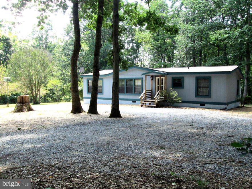 This is a Modular! Documented & have a letter from VDCH.  Fantastic location  nice yard but mostly wooded 7 acres (2 sep. lots) Freshly painted exterior, nice interior colors, stone fireplace, spacious kitchen w/butcher block island. Split Bedroom plan, lots of closet space & shelving. Spacious family room w/ flue for woodstove, slider to small deck. Kid play area, chicken pen,  fire pit, shed.
