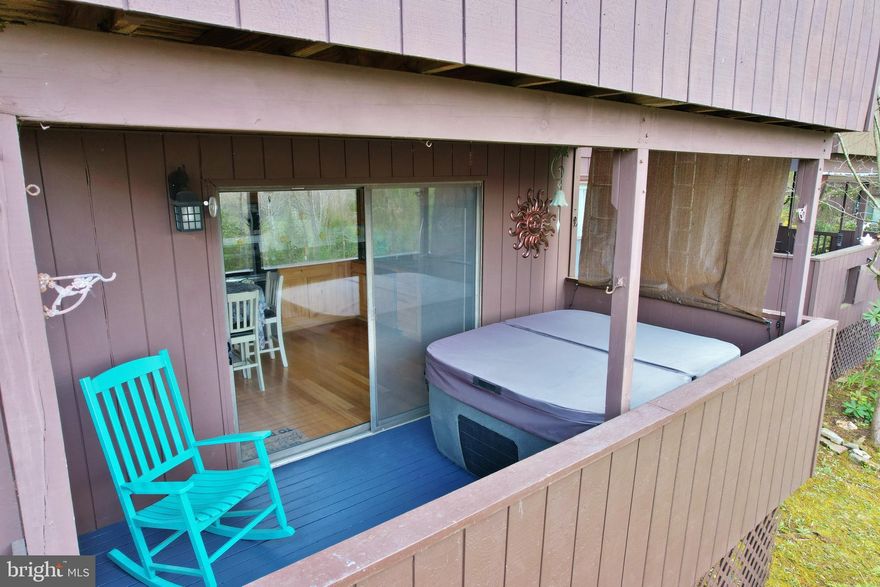 "Wolf Lodge" - Enjoy a cup of coffee on your deck with views of Great North Mountain. You will love the layout of this super clean, renovated condo within walking distance to Bryce Resort. Completely renovated with newer appliances, new subfloor/bamboo flooring throughout (tile floor in bathrooms), two full-size bathrooms, new heat pump in 2022, two forty-gallon inline hot water heaters, all double-hung tilt-in windows throughout, washer/dryer in insulated storage area with heating inside, and new circuit breaker box in 2022. You will love soaking in the 4-person (220v) hot tub on the reinforced deck. Sit by the fire near your wood-burning fireplace (HOA supplies firewood). One of the perks of this property is an additional back entrance/exit from the deck. So, there are two entrances; you pick! There is also a space in front for chairs and a grill that is ours to enjoy! This property is just a 2-minute drive to Bryce Resort, making it an ideal mountain getaway. The resort area offers the following: small airport, library, dog park, indoor pool, swimming pool, inground outdoor swimming pool, lazy river, pickleball, tennis, playground, golf, mini golf, lake, mountain biking, skiing, snowboarding, ice-skating rink, and restaurants, to name a few. 1.5 hours from NoVA. There is a farmers' market on Wednesdays during the summer. Call now for an appointment.